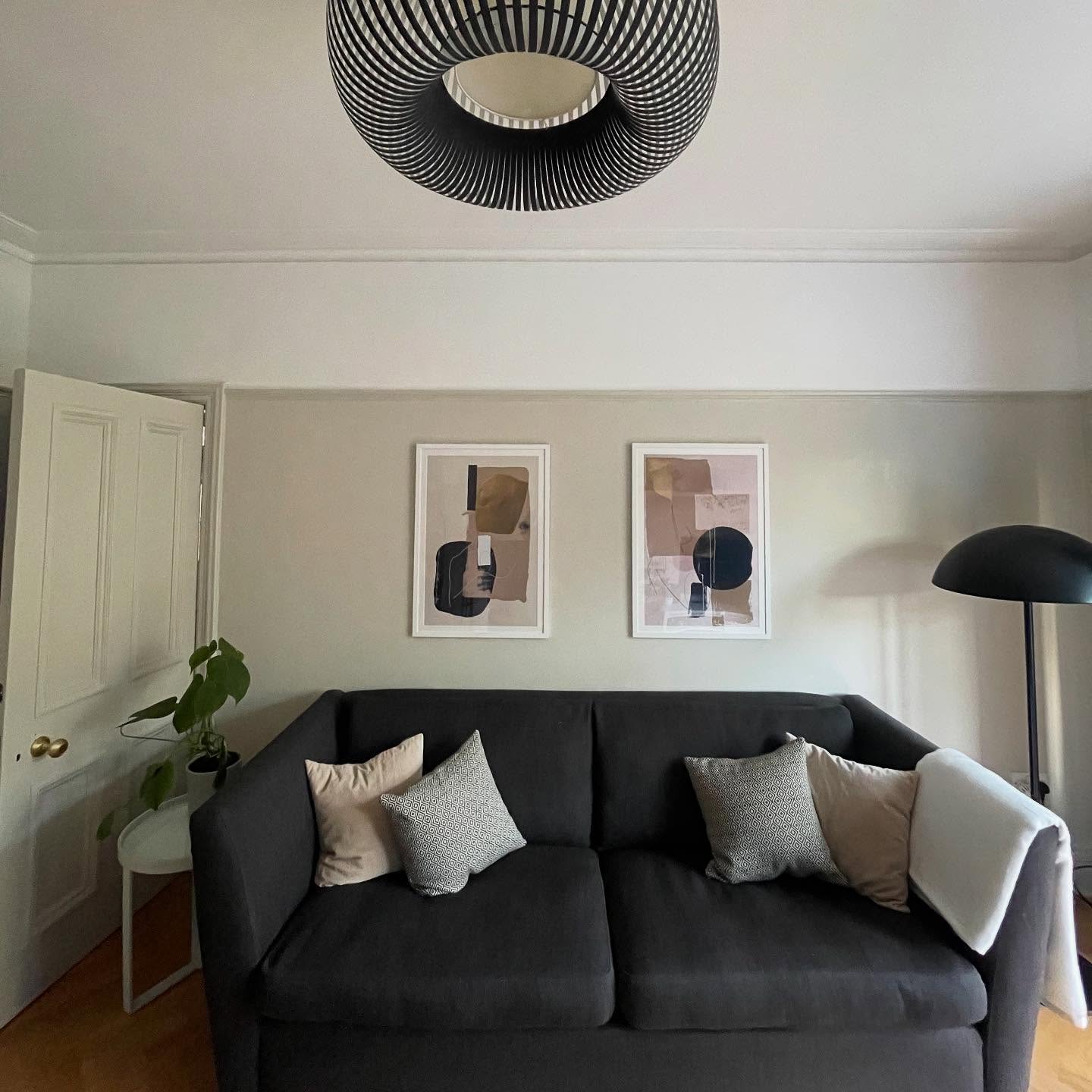 7. Use Sculptural Lighting Around a Compact Sofa