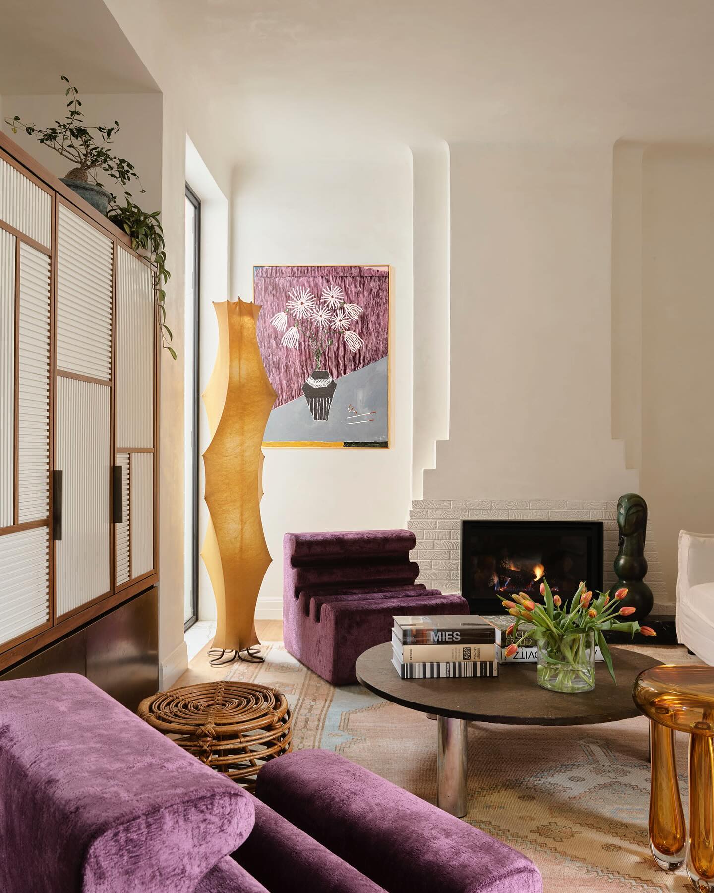 19. Warm Plum Seating With Amber Accents