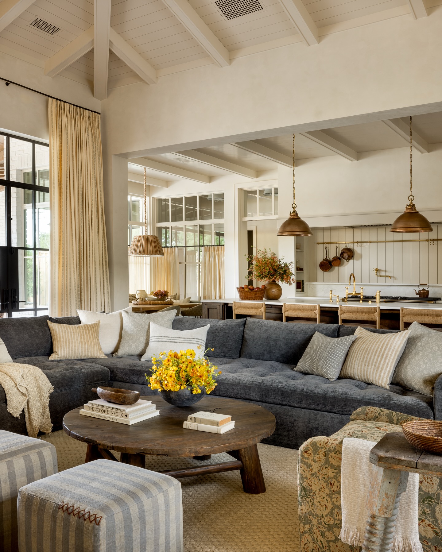 Add Upholstered Stools Beside a Patterned Armchair
