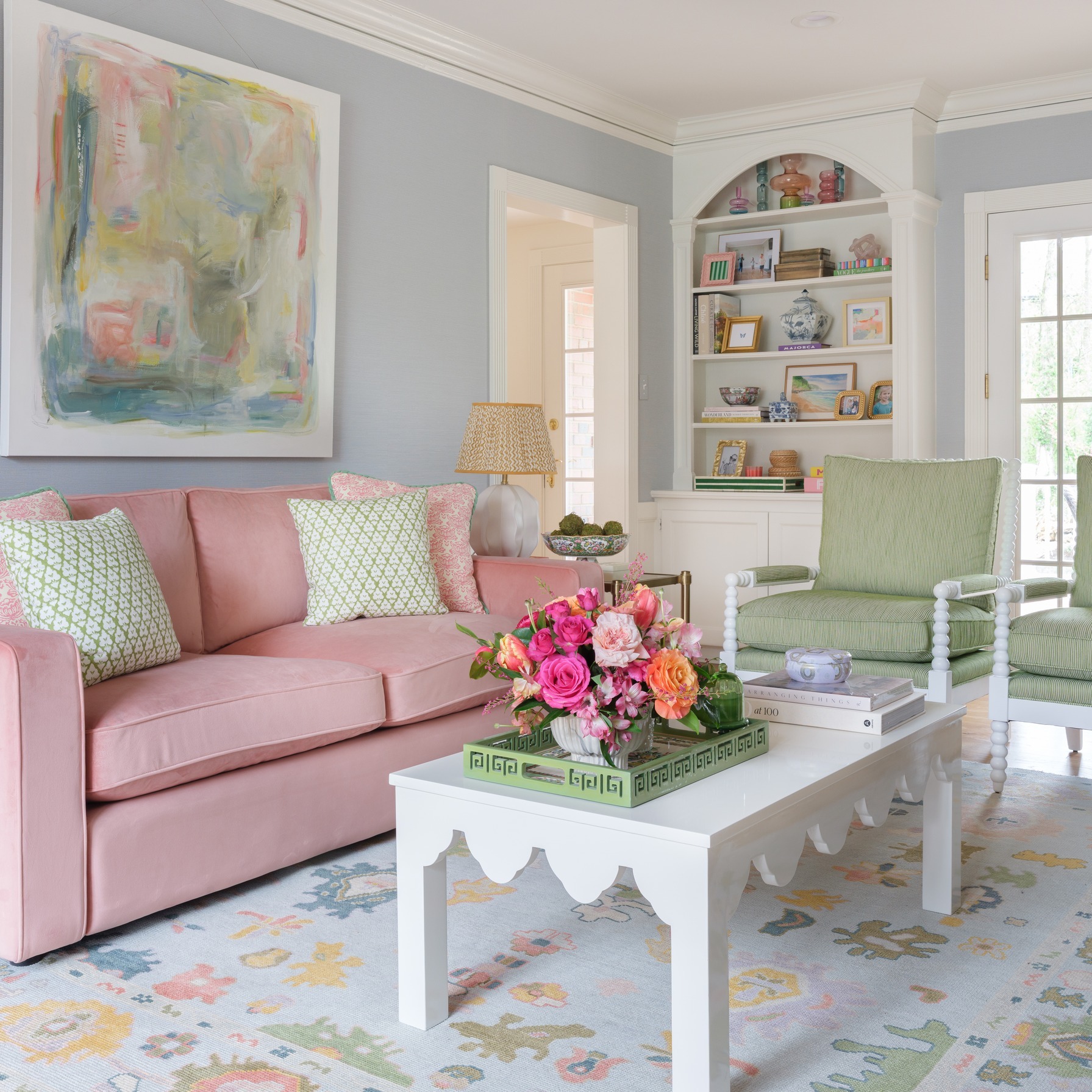 2. Connect Pastel Furniture With a Multicolored Rug