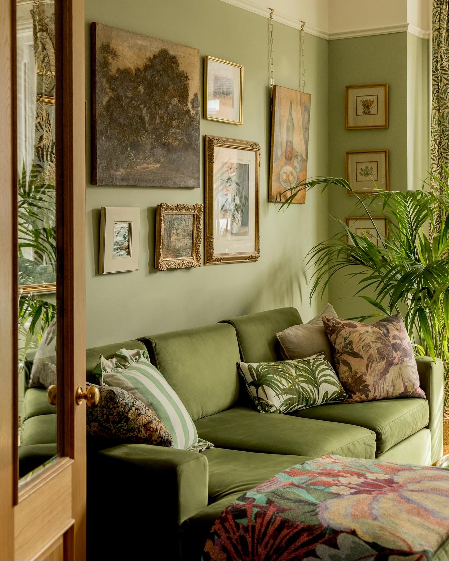3. Give a Collected Gallery Wall a Sage Backdrop