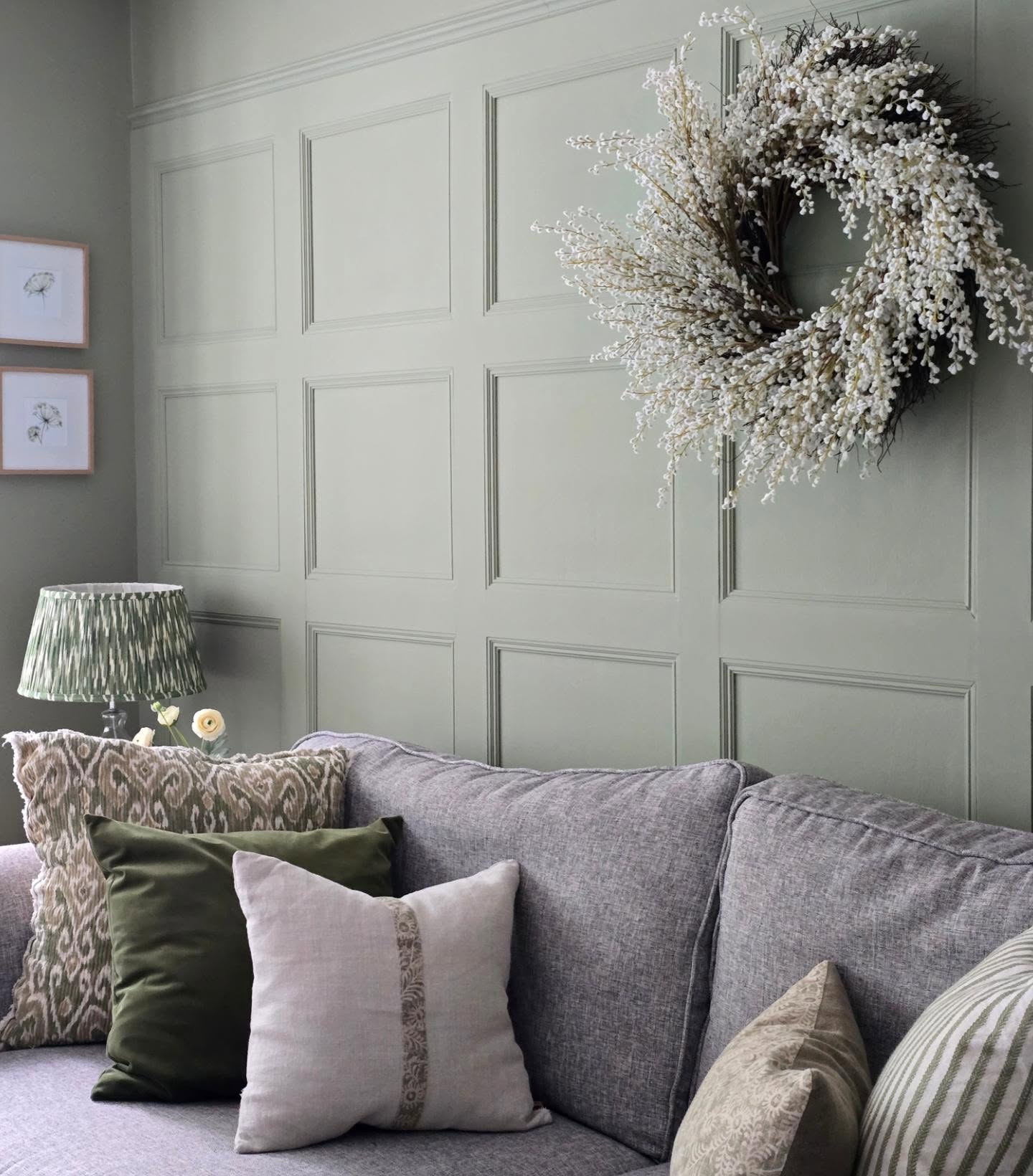 10. Connect a Gray Sofa with Green Patterned Textiles
