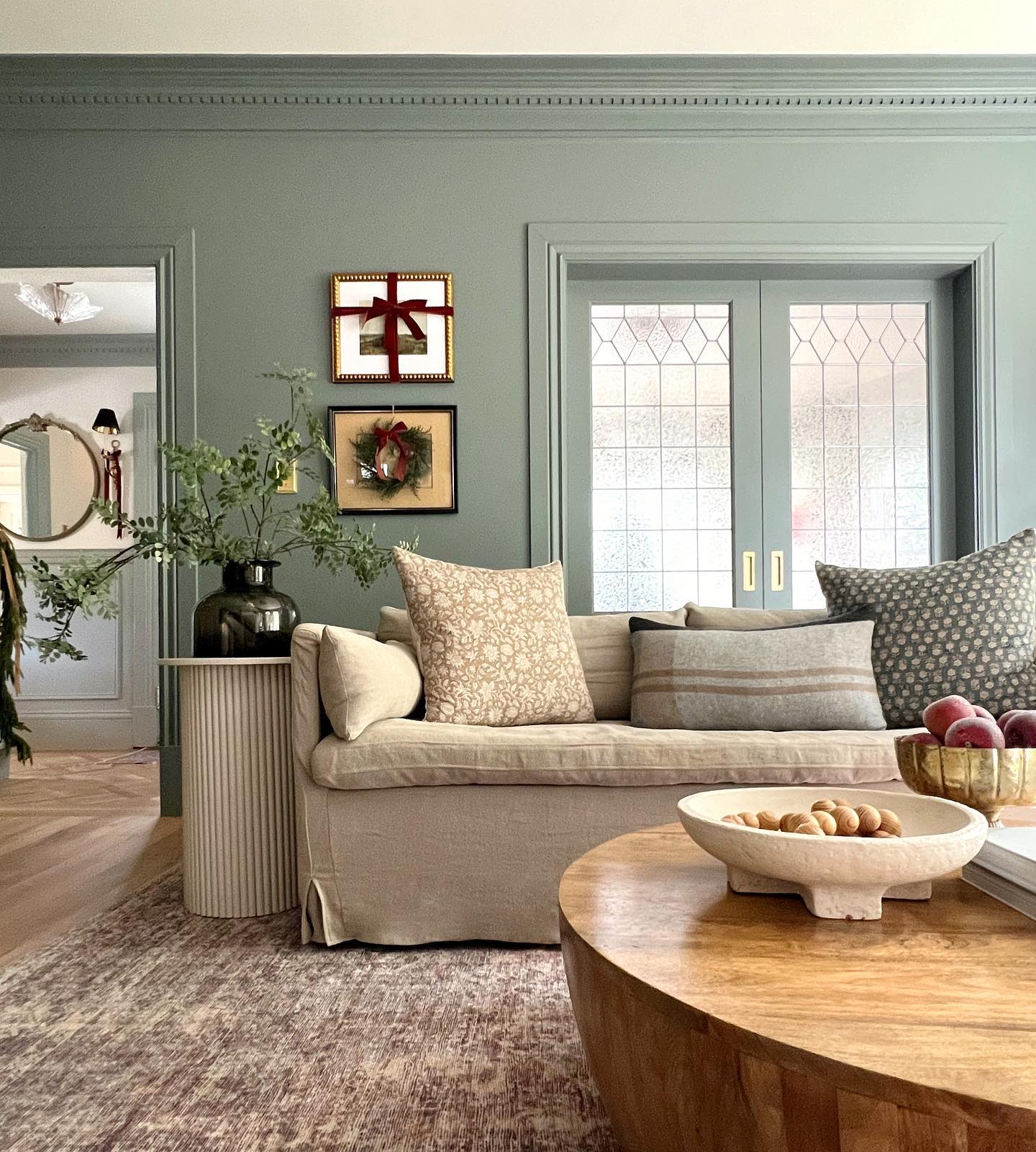 17. Choose a Low Sofa to Reveal Sage Room Details