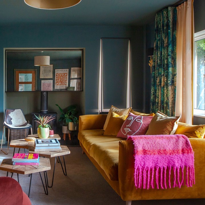 7. Brighten a Teal Room With Mustard and Pink