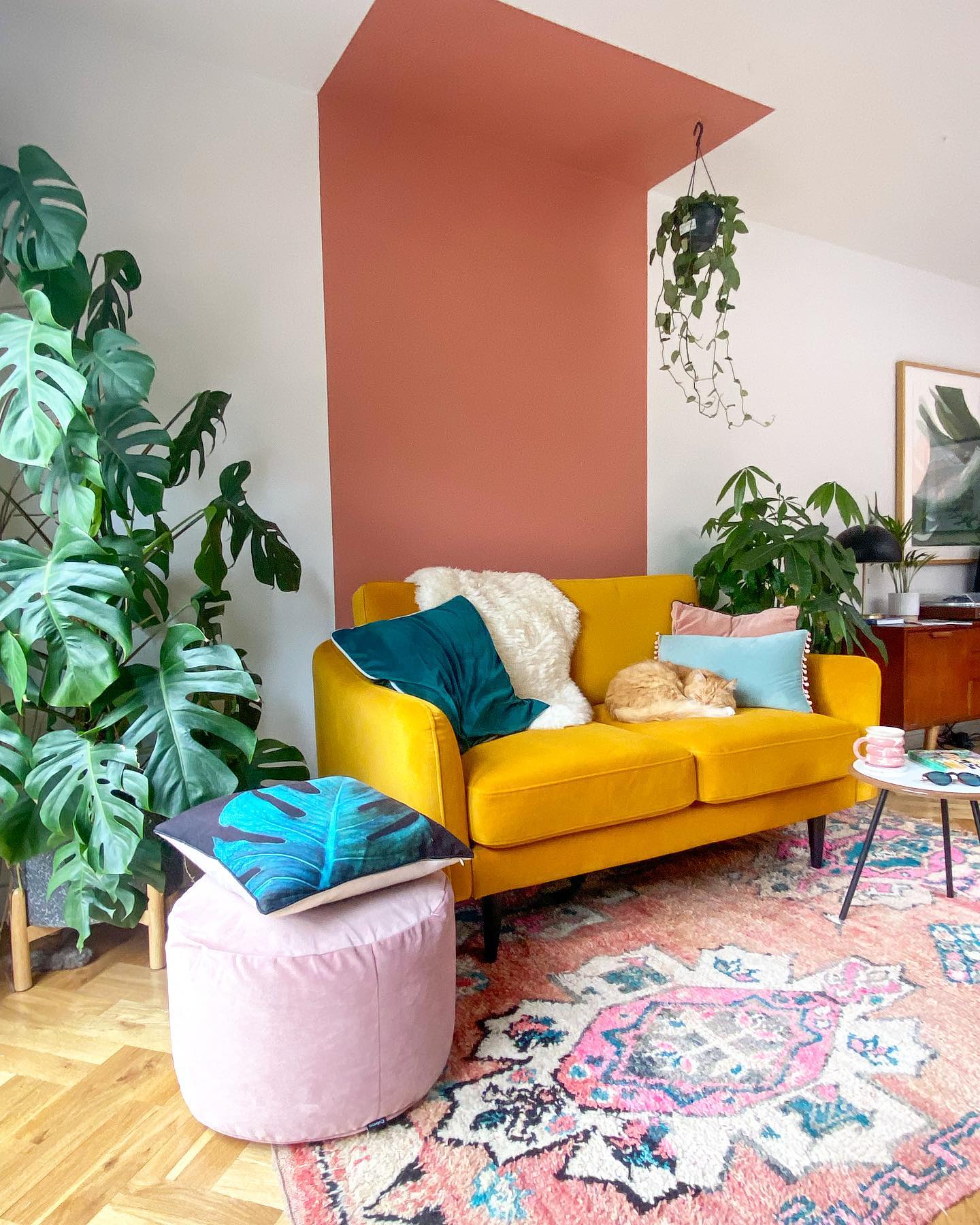 8. Extend a Coral Color Block Above a Yellow Loveseat