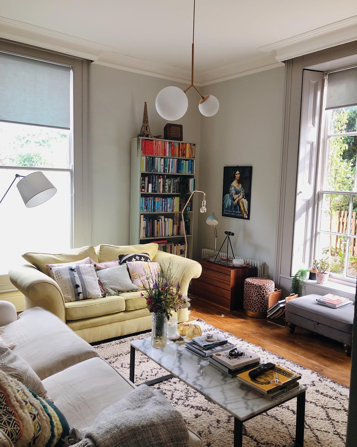 20. Make a Pale Yellow Loveseat Work With Collected Furniture