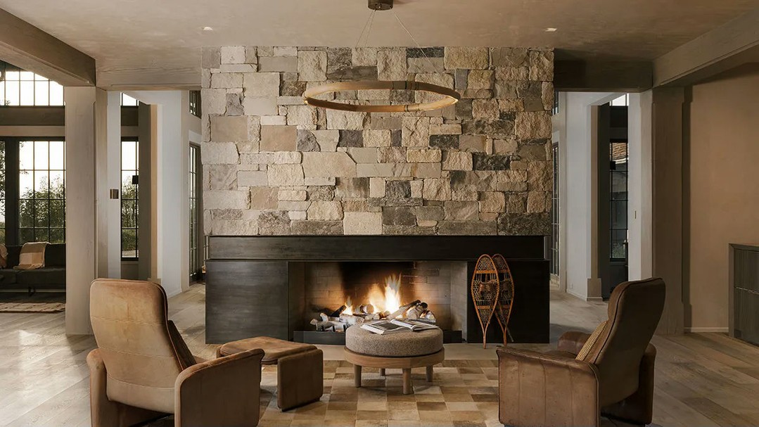 3. Frame Brown Armchairs With a Broad Black Hearth