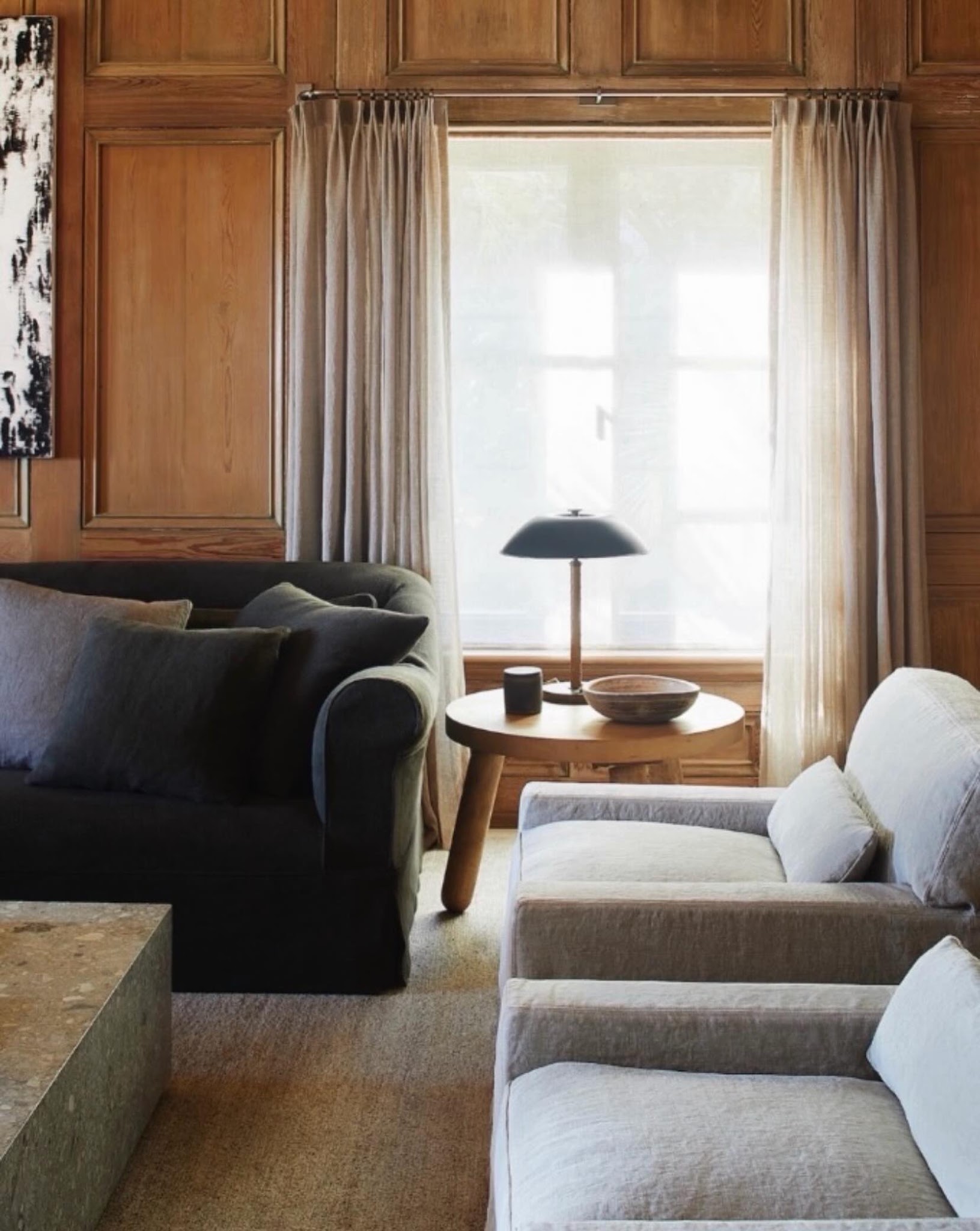 8. Give Brown Paneling a Simple Black Lamp