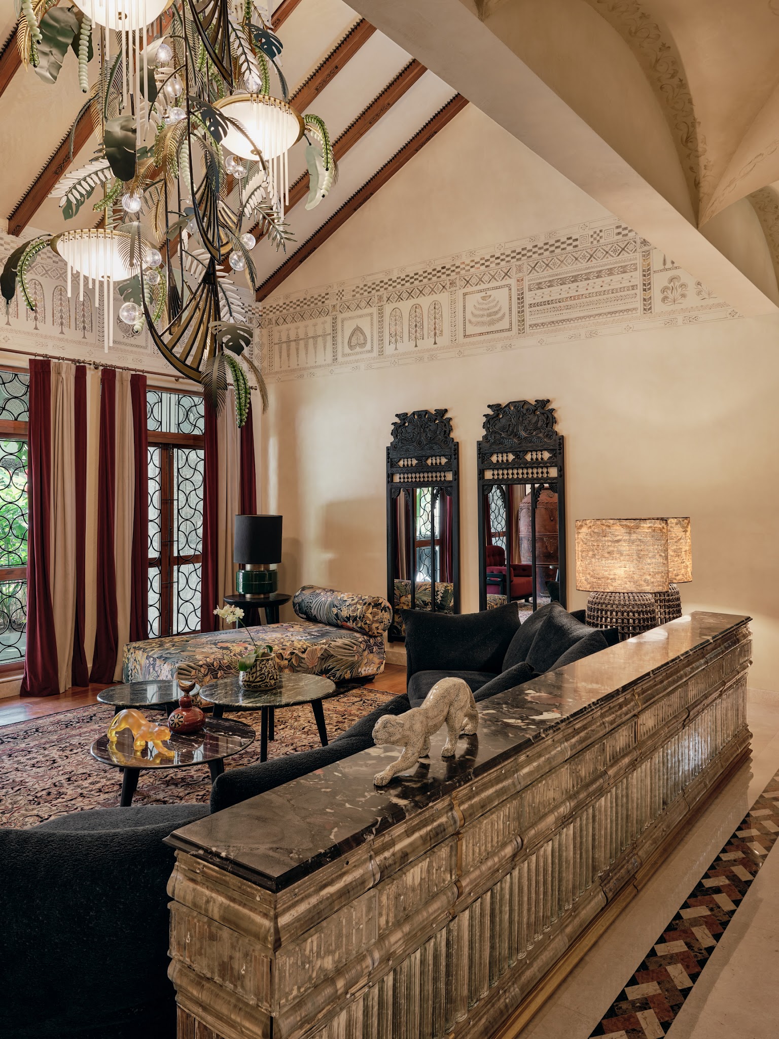 11. Repeat Ornate Black Mirrors Above a Warm Console