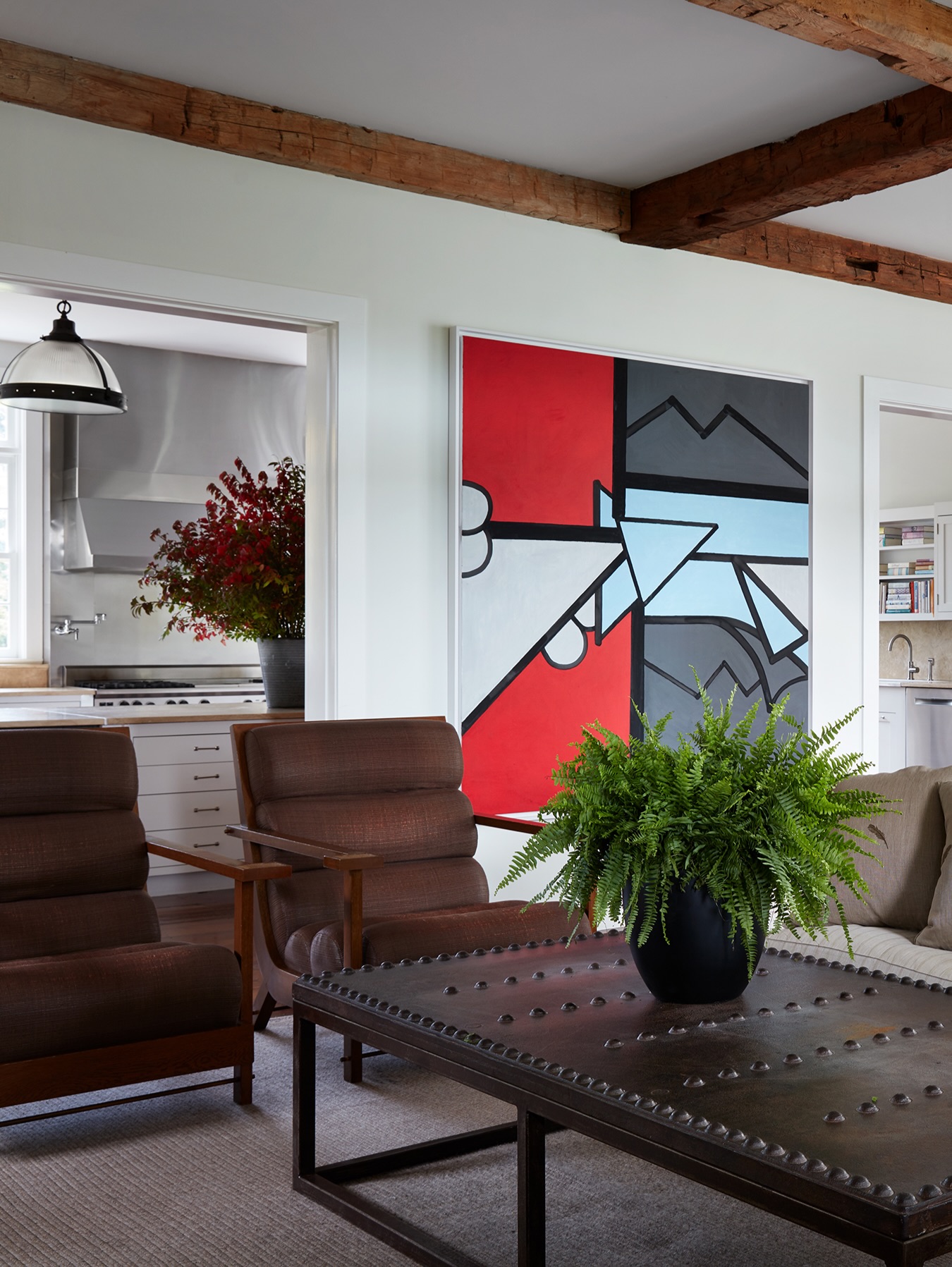 19. Use Bold Black Artwork to Define Brown Seating
