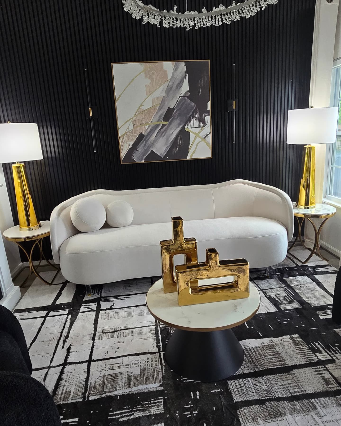 2. Frame a Pale Sofa with Golden Lamps
