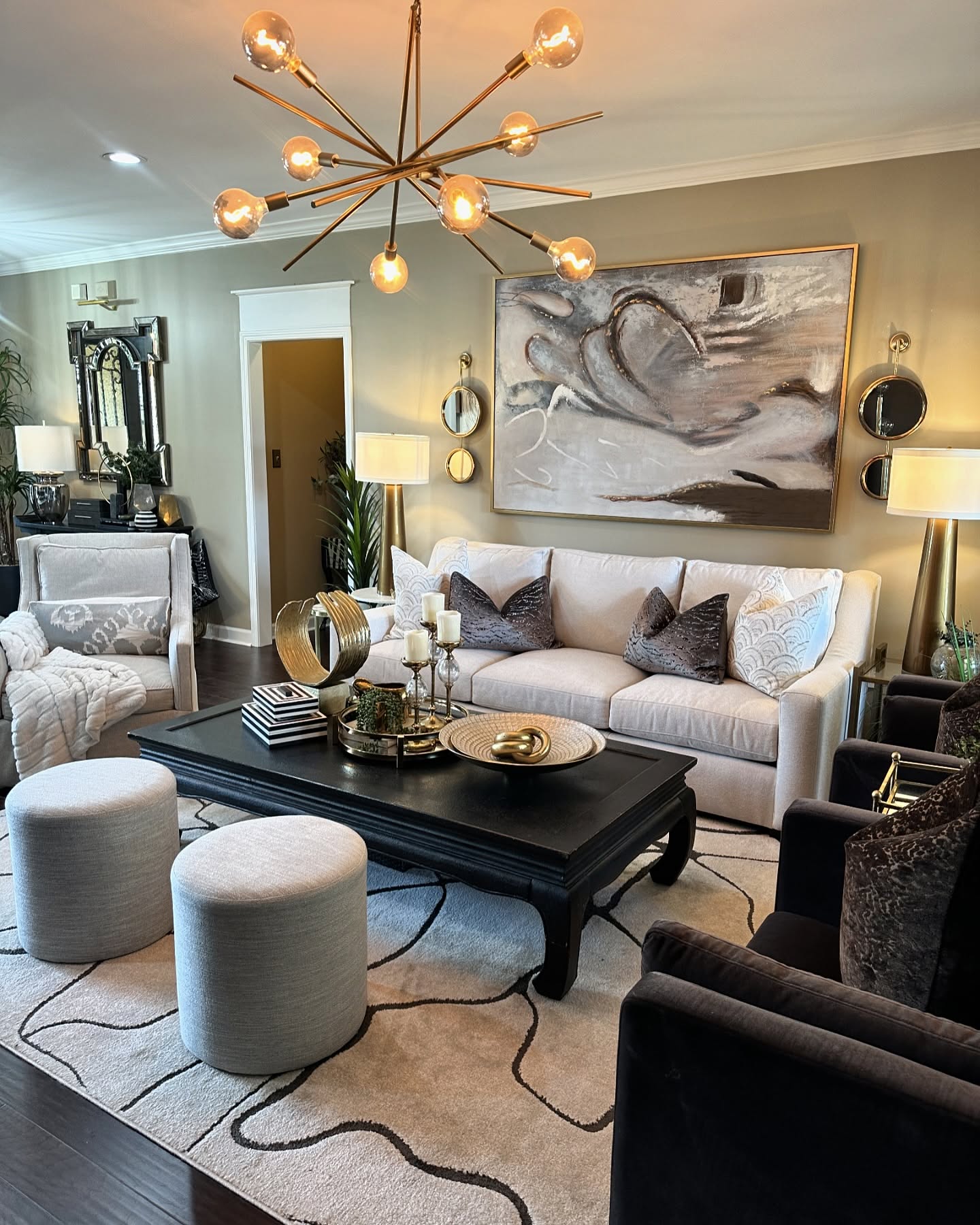 7. Hang a Gold Starburst Over Black Furniture