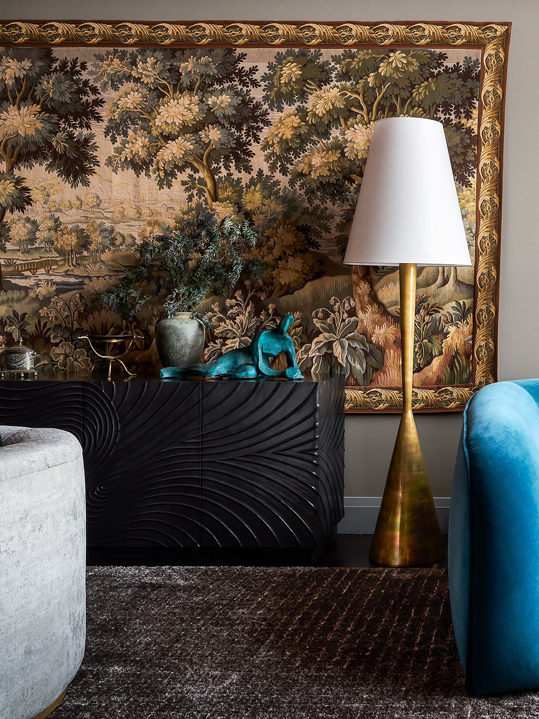 19. Set a Golden Lamp Beside Carved Black Storage