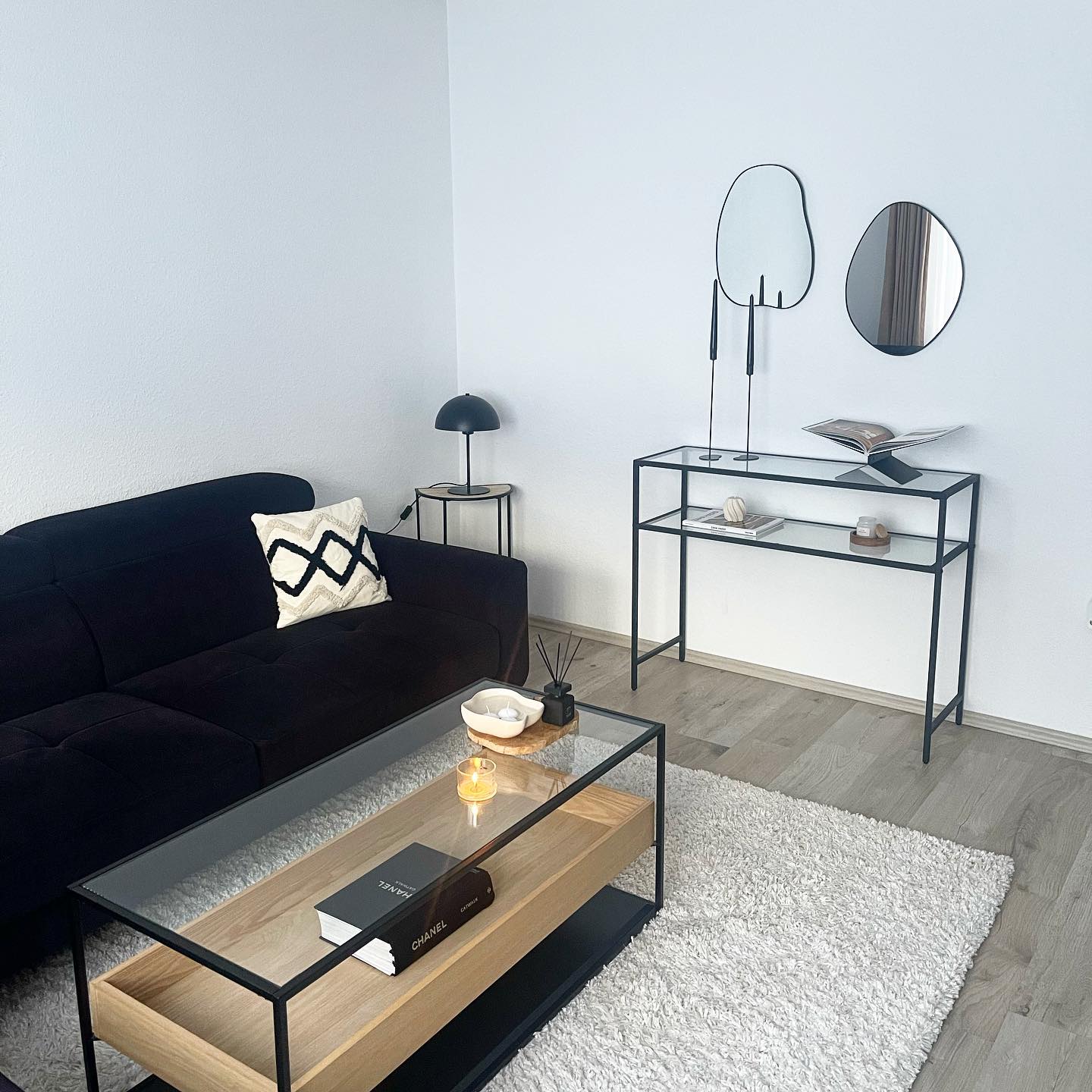 2. Pair Organic Mirrors With a Black Sofa