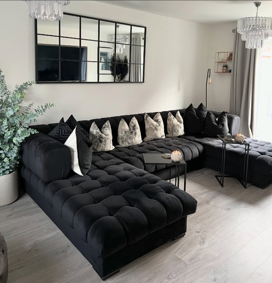 11. Repeat Silver Pendants Over a Black Sectional