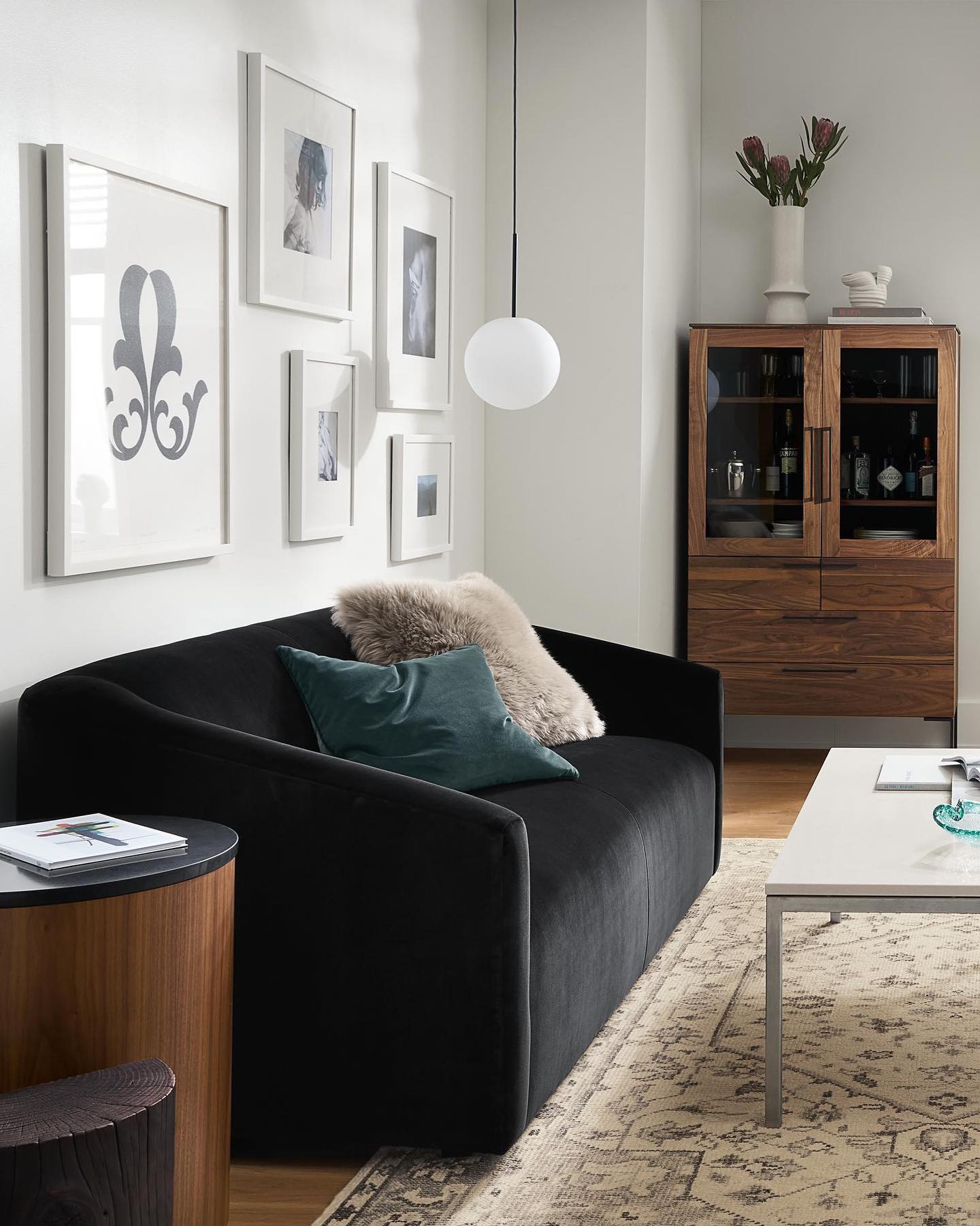 17. Lighten a Black Sofa With a Slim Silver Table Frame