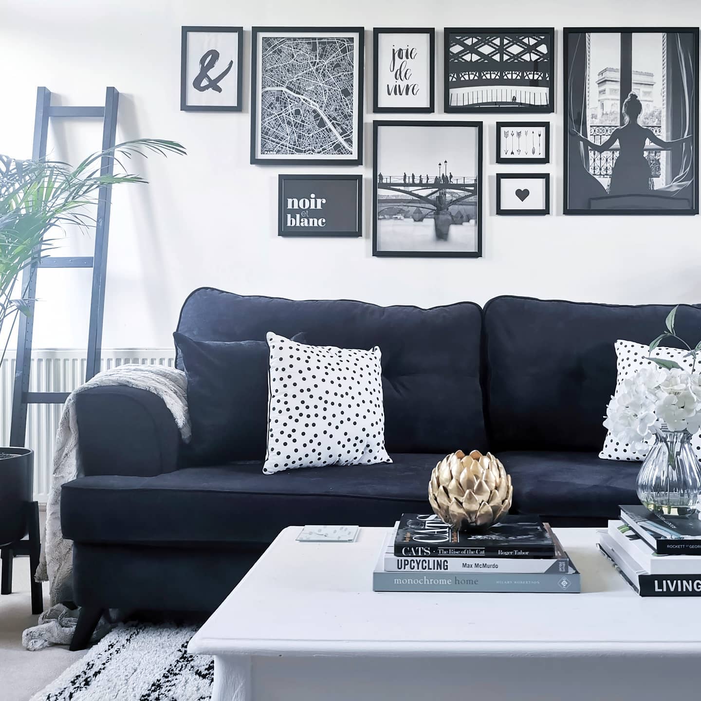 2. Pair Black Upholstery With a Gallery Wall