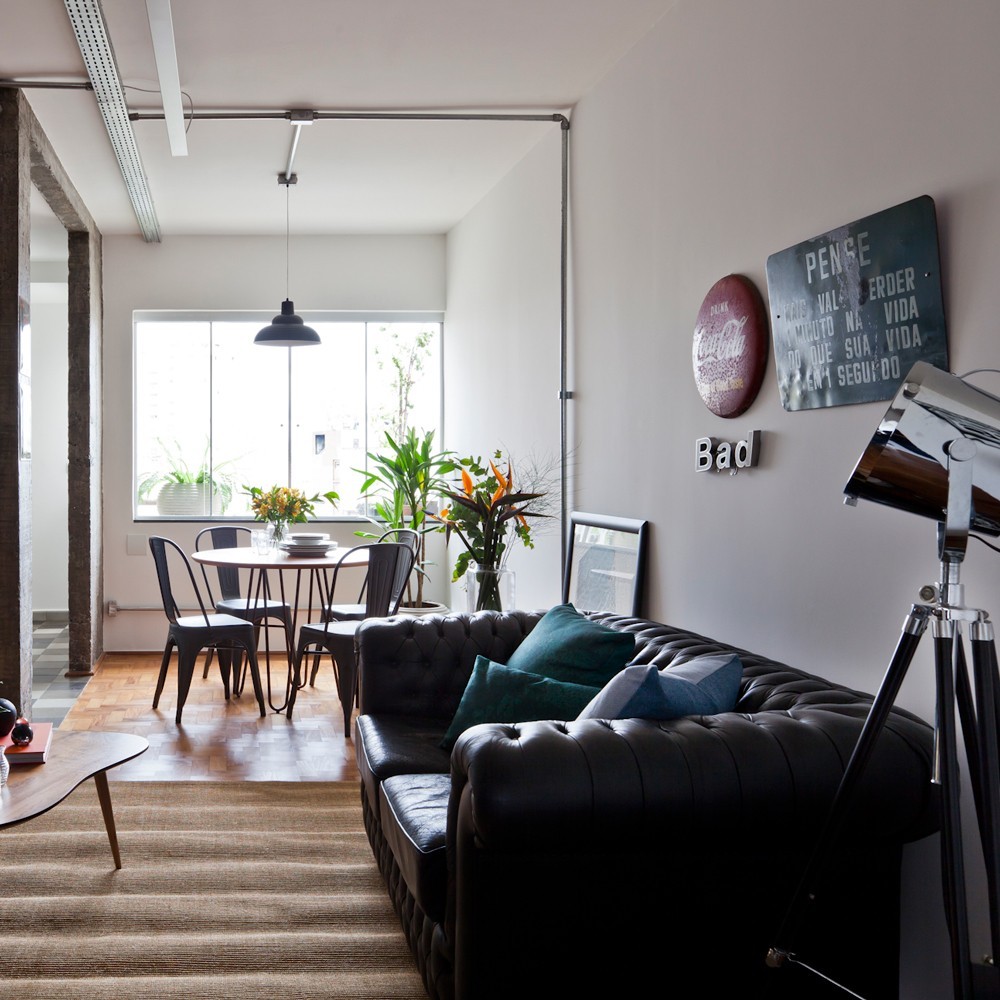 10. Use a Black Sofa to Zone a Compact Loft