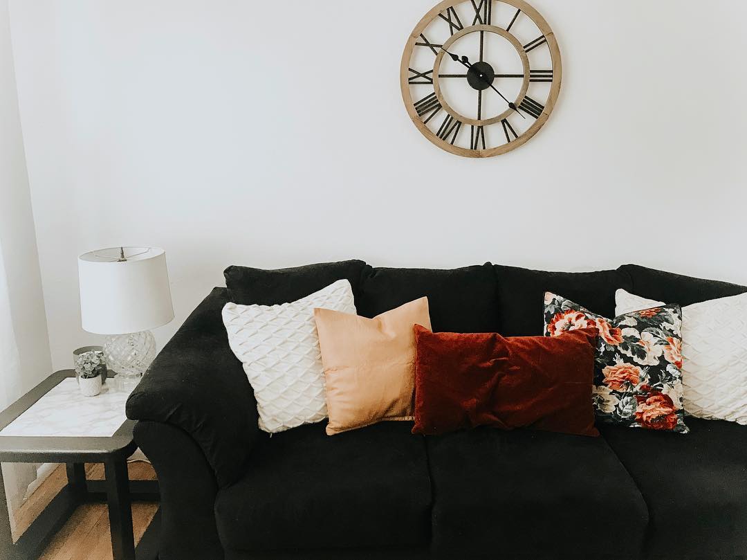 13. Warm Up Black With Rust and Floral Pillows