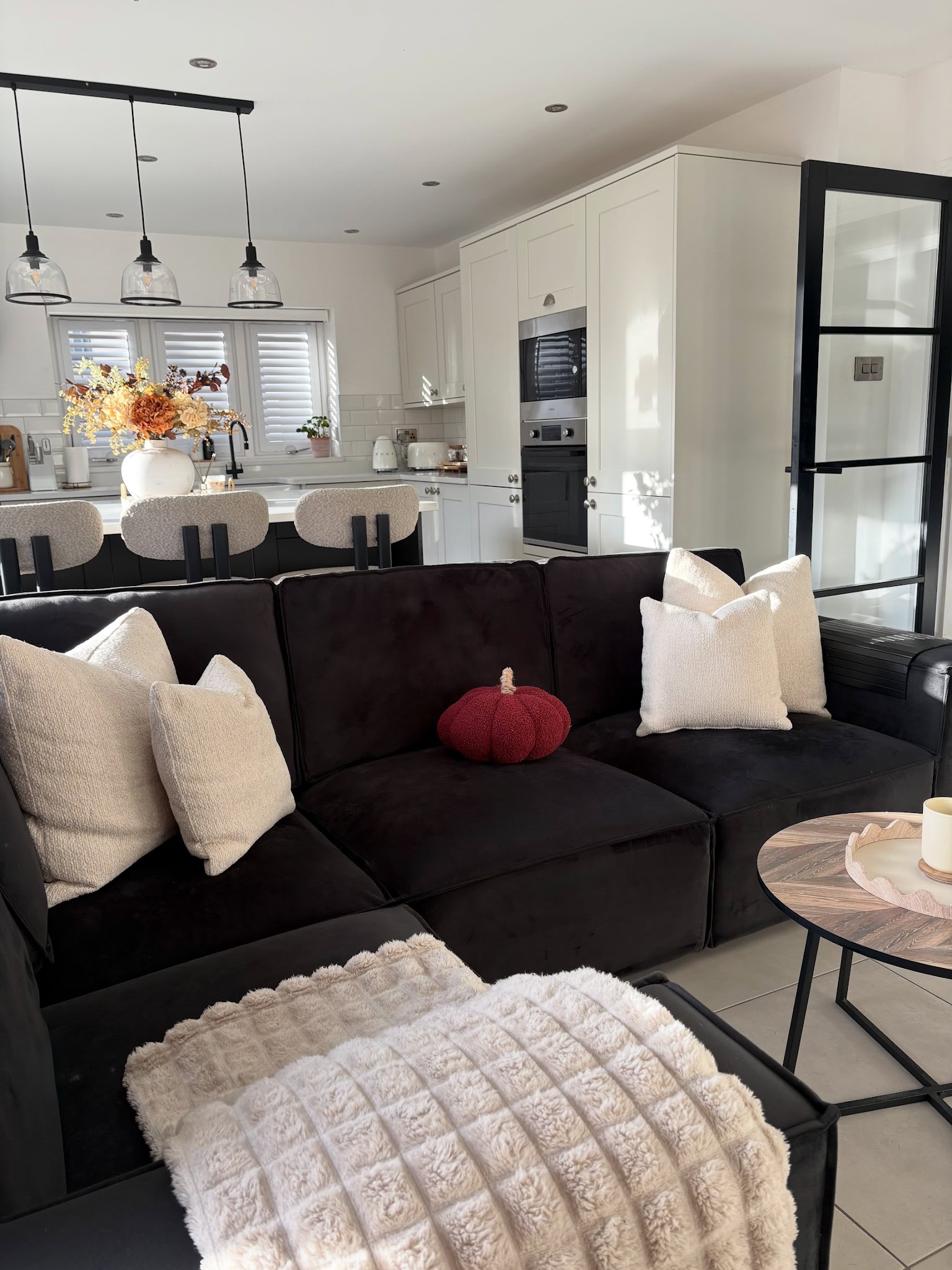 18. Connect a Black Sofa to an Open Kitchen
