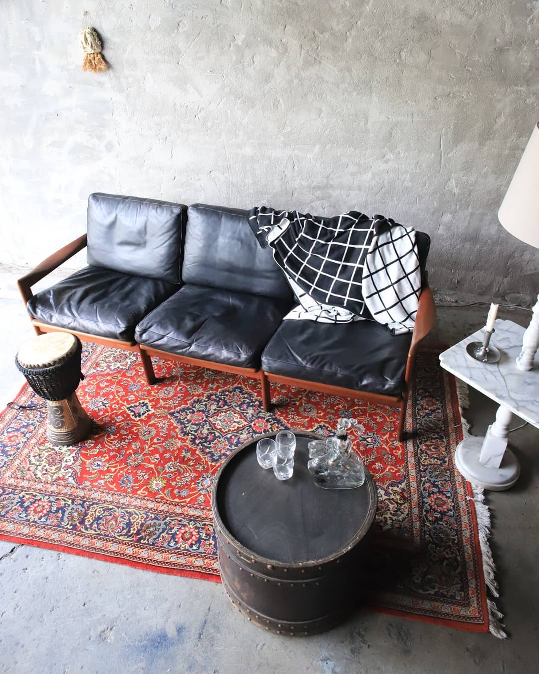 19. Ground Vintage Black Leather With a Red Rug