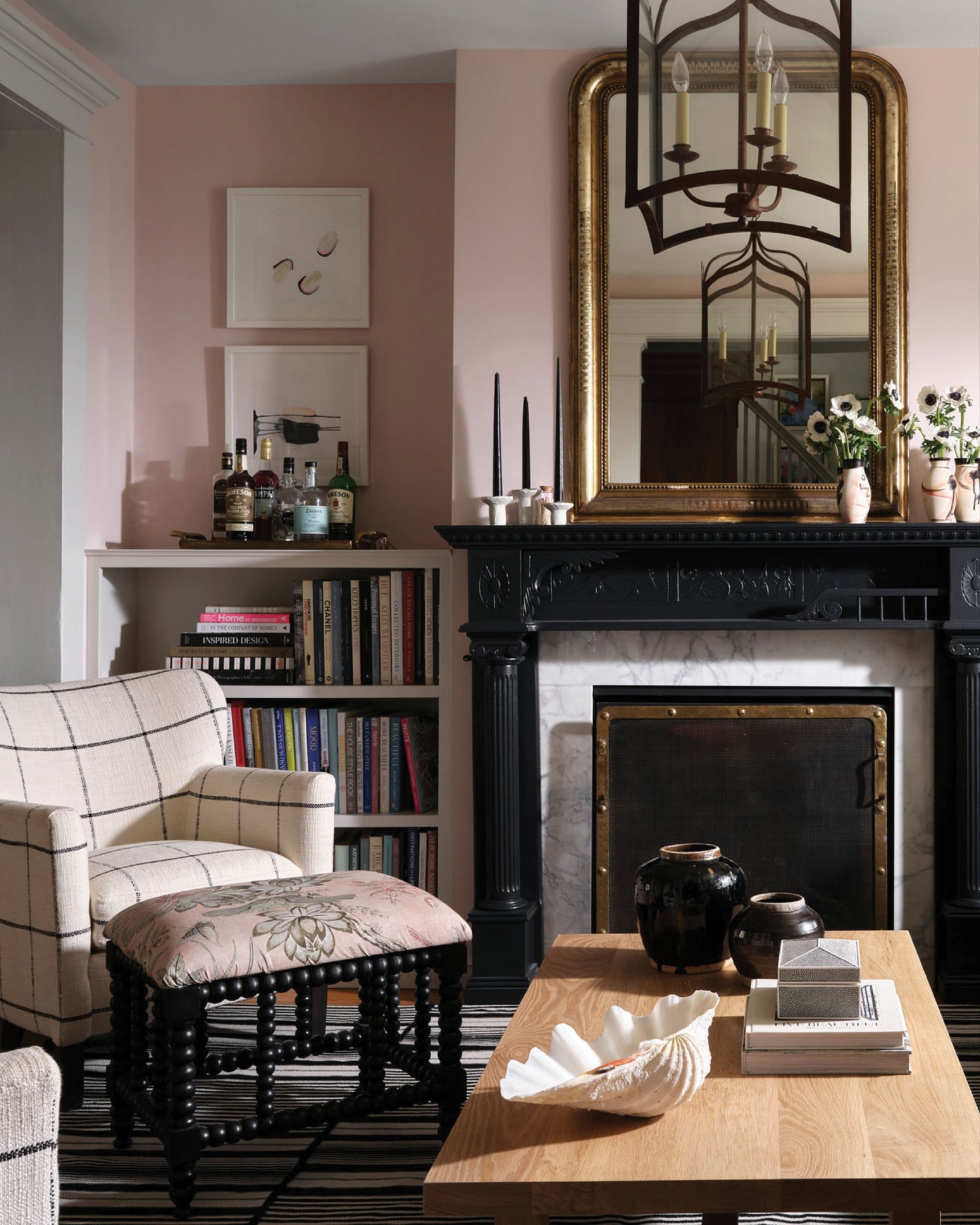 13. Pair a Carved Black Mantel With Blush Walls