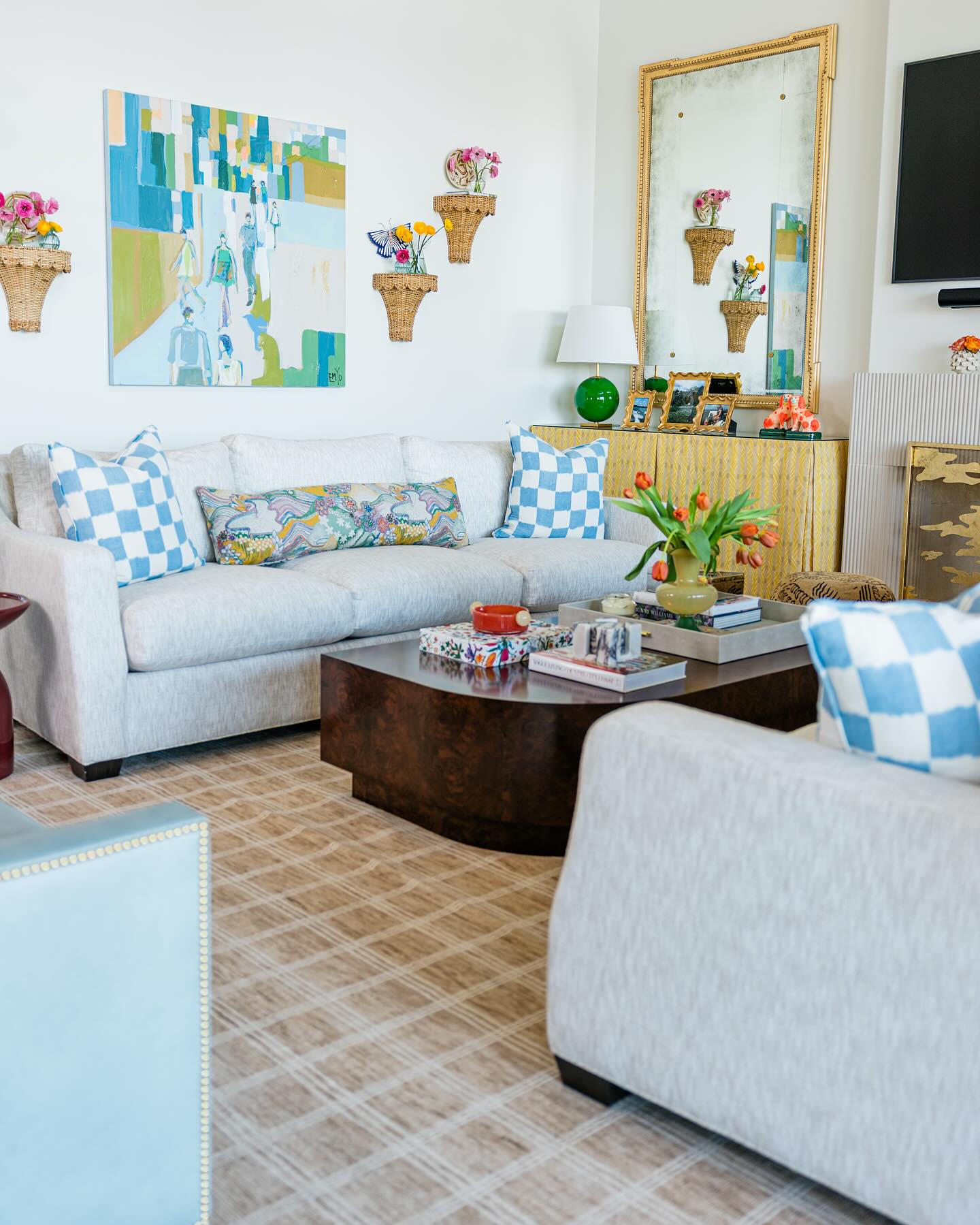 3. Pale Blue Seating with Green Art Accents