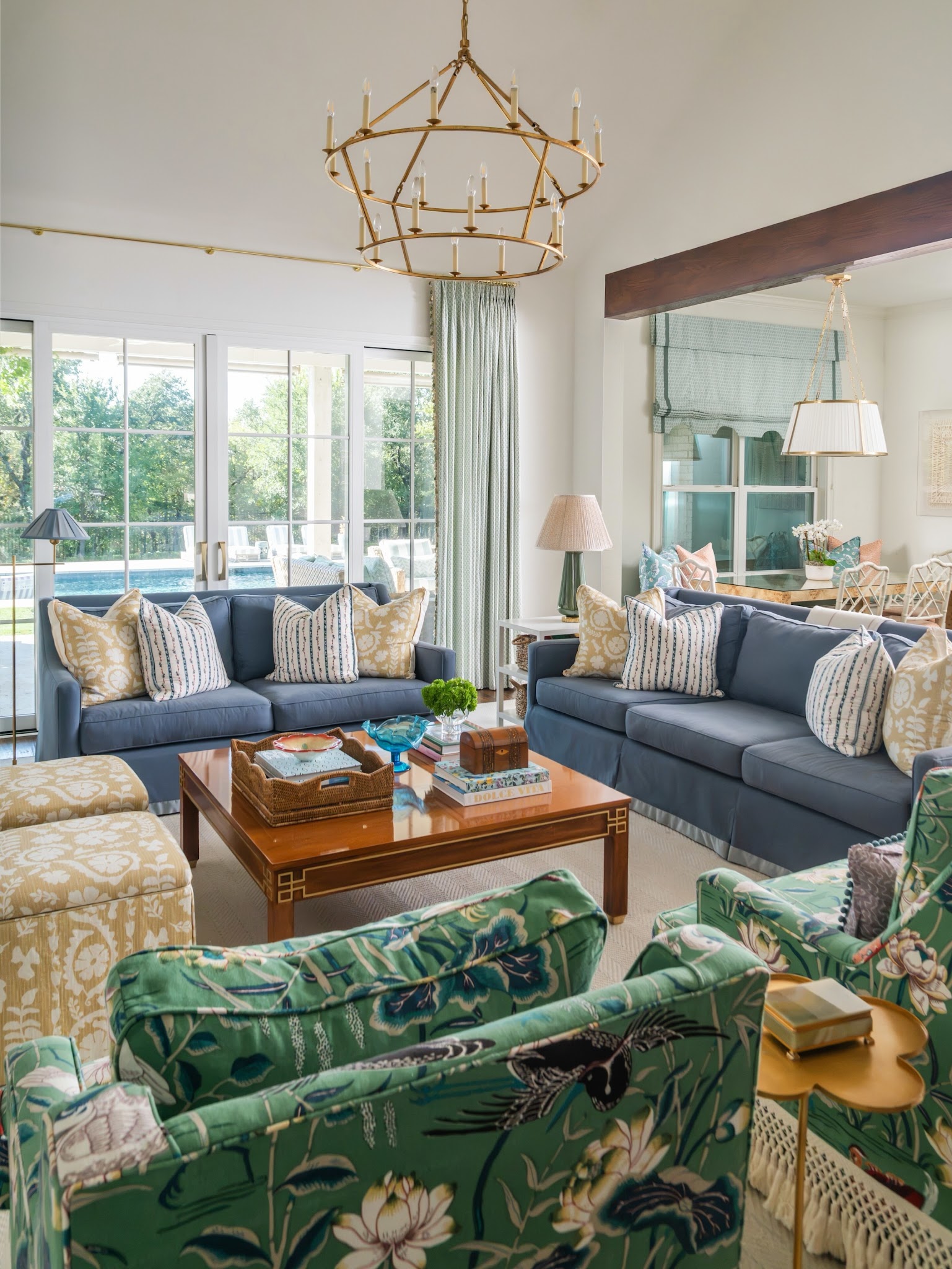 6. Green Floral Chairs Facing Blue Sofas
