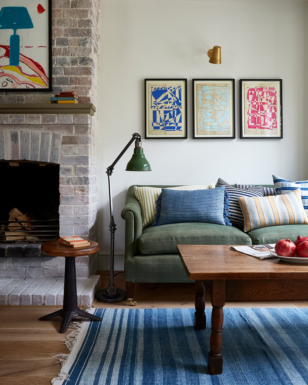 16. Layer Blue Stripes Around a Muted Green Sofa