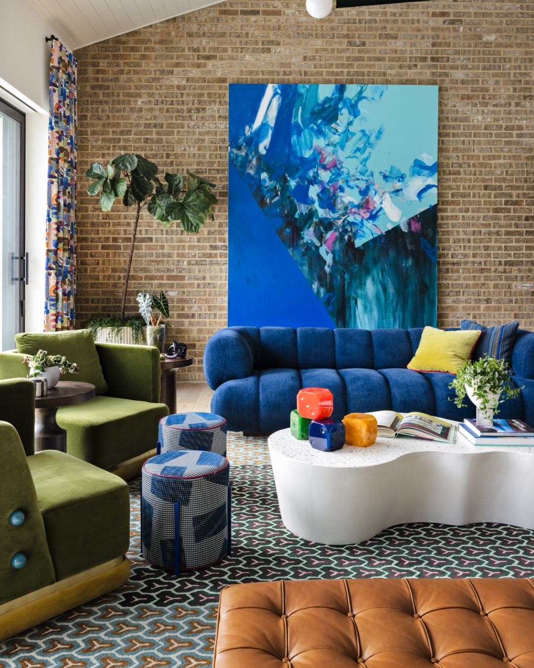 19. Set Blue and Green Seating Against Brick