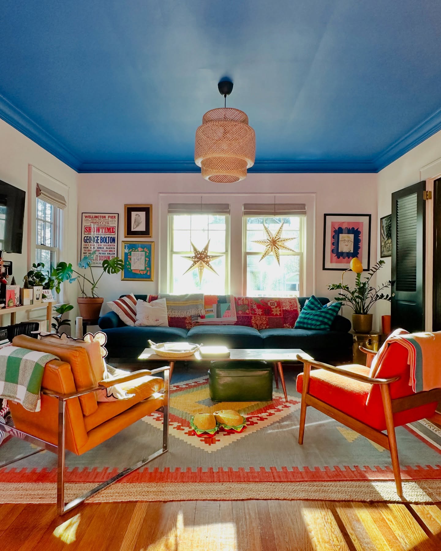 2. Carry Blue Above a Pair of Orange Chairs