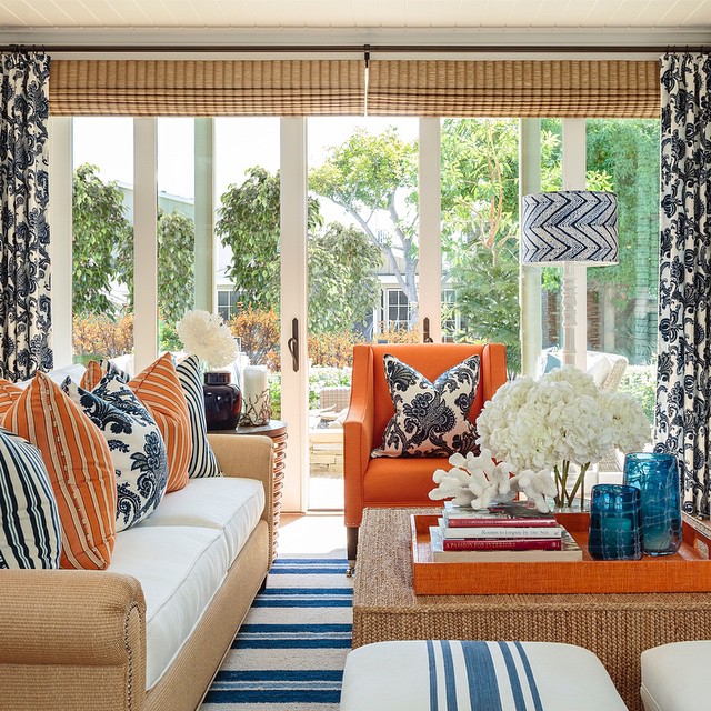 4. Mix Crisp Stripes With Orange Accent Seating