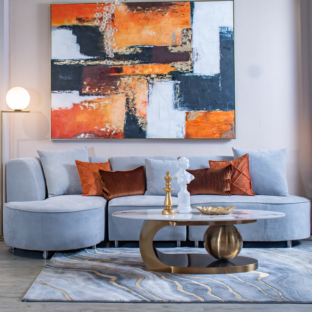 11. Accent a Powder Blue Sofa With Burnt Orange Pillows