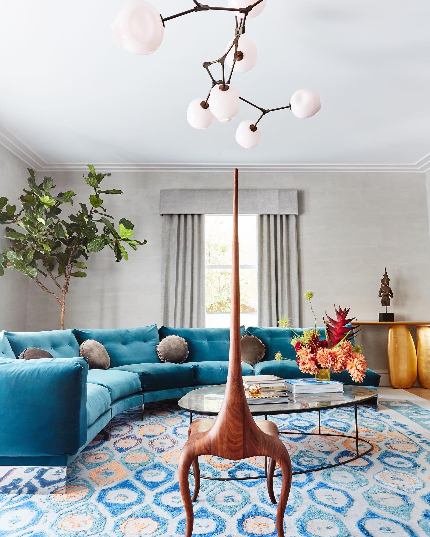 13. Introduce Orange Through a Patterned Blue Rug
