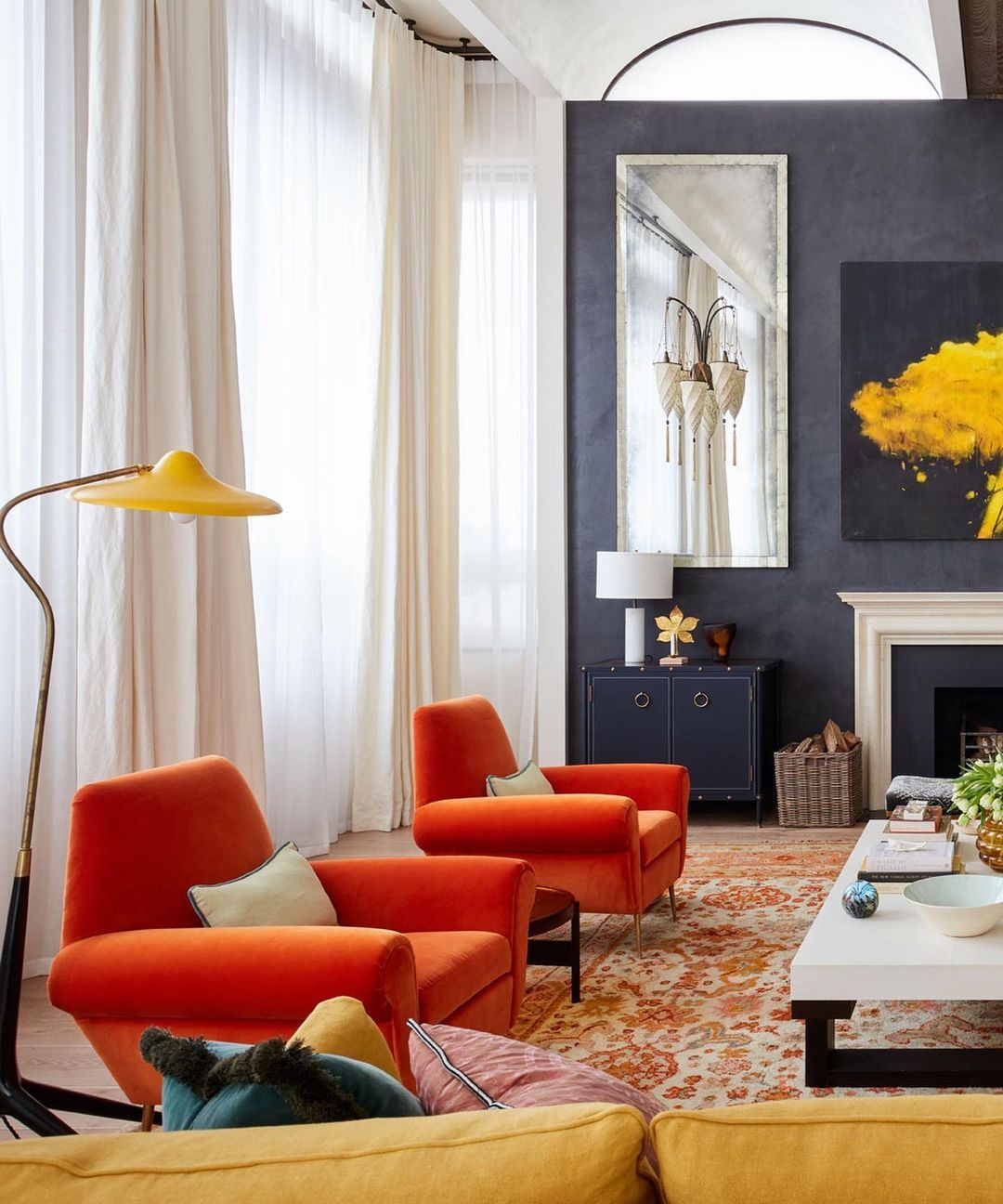 15. Set Orange Chairs Beside a Blue Gray Feature Wall