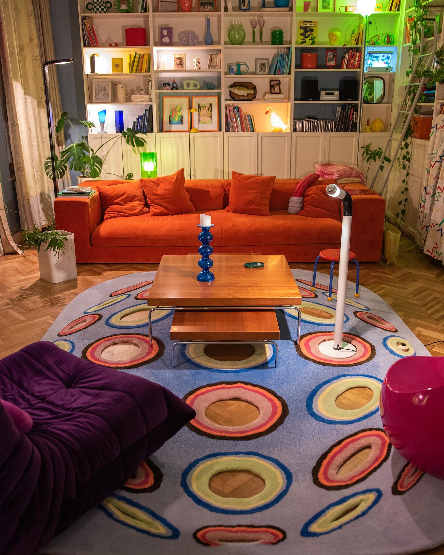 17. Give an Orange Sofa a Playful Blue Rug