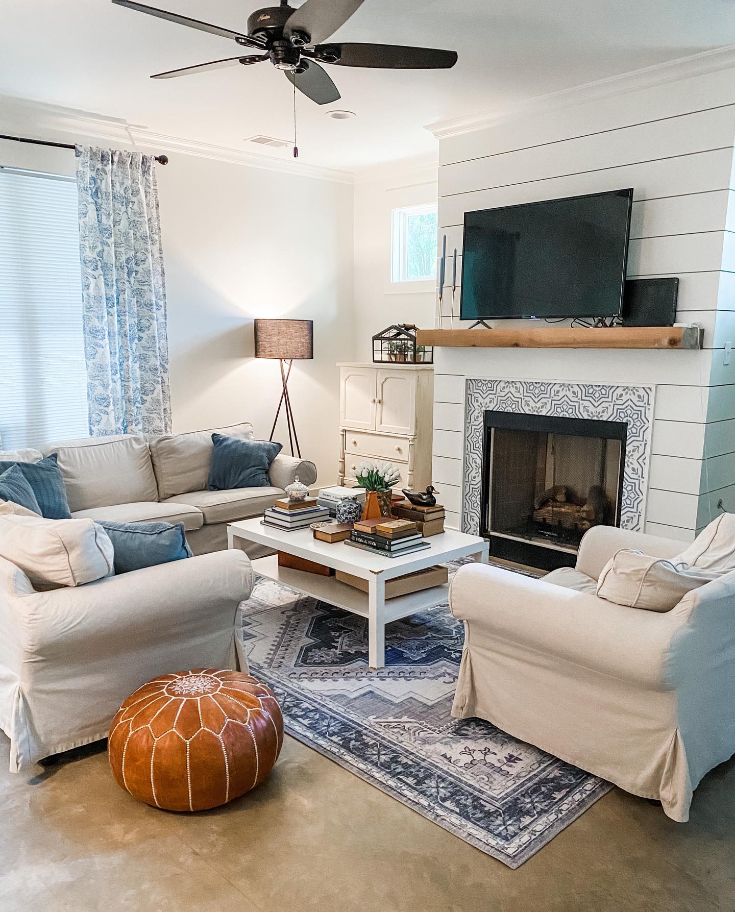 20. Mix Blue Patterns Against a White Fireplace Wall
