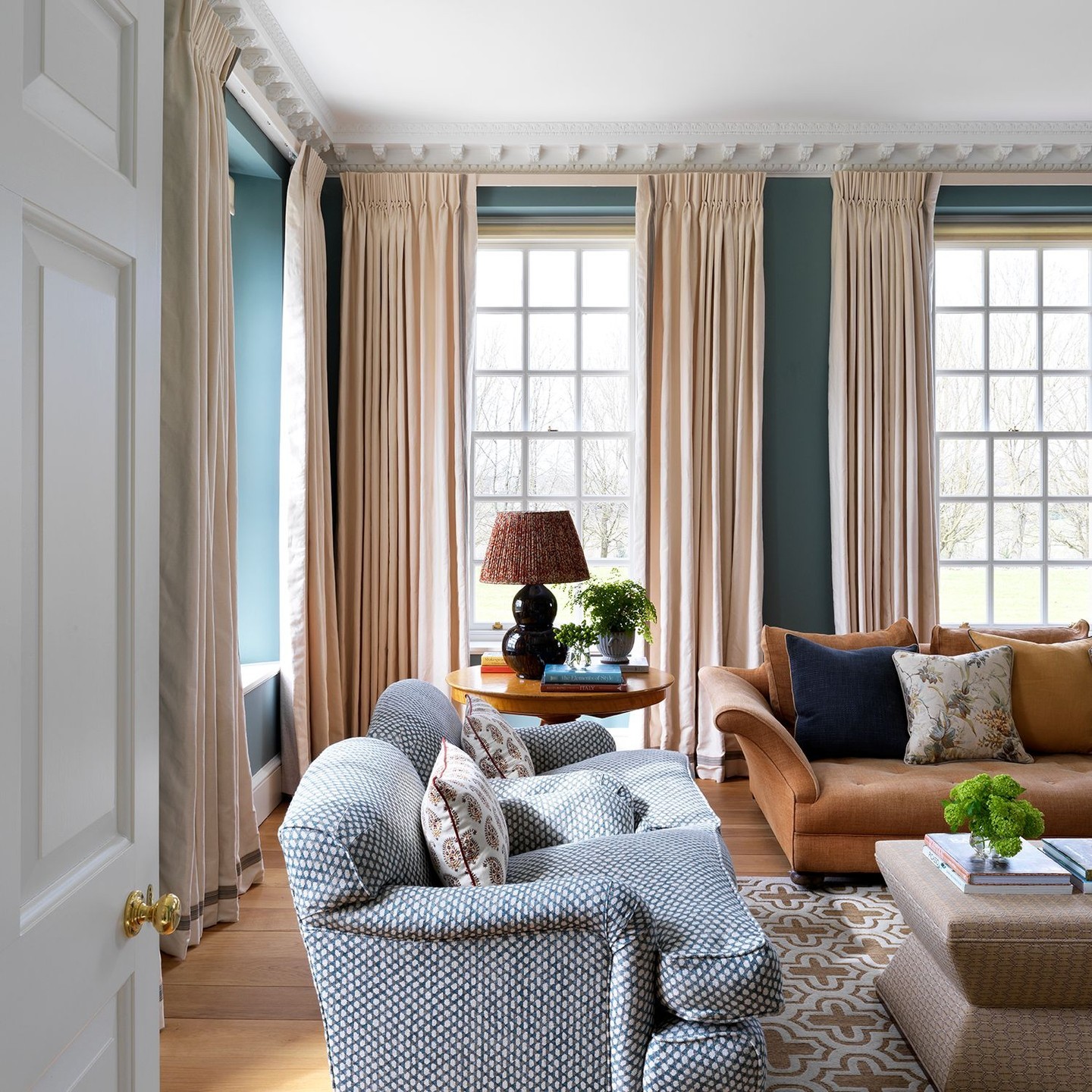 10. Frame Blue Walls with Long Cream Curtains