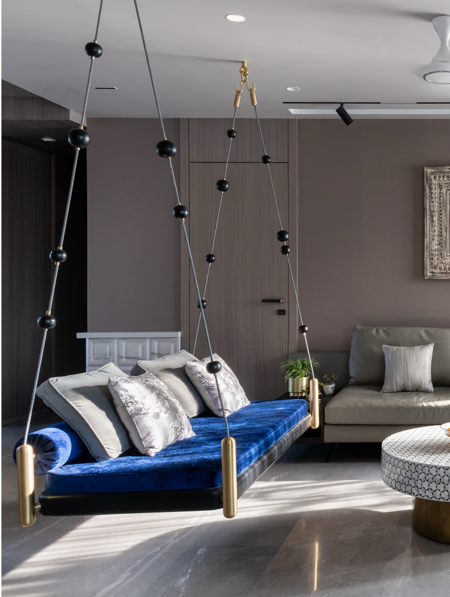 16. Choose a Blue Swing as a Statement Seat