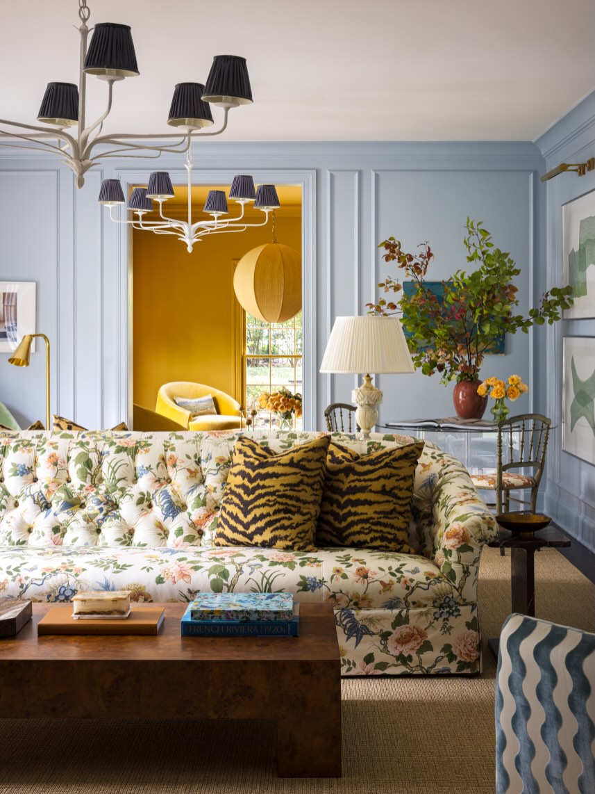 18. Use Soft Blue Walls Behind a Floral Sofa