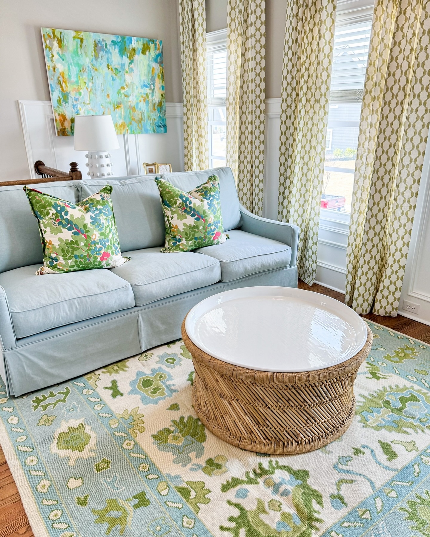 19. Refresh a Pale Blue Sofa with Green Prints