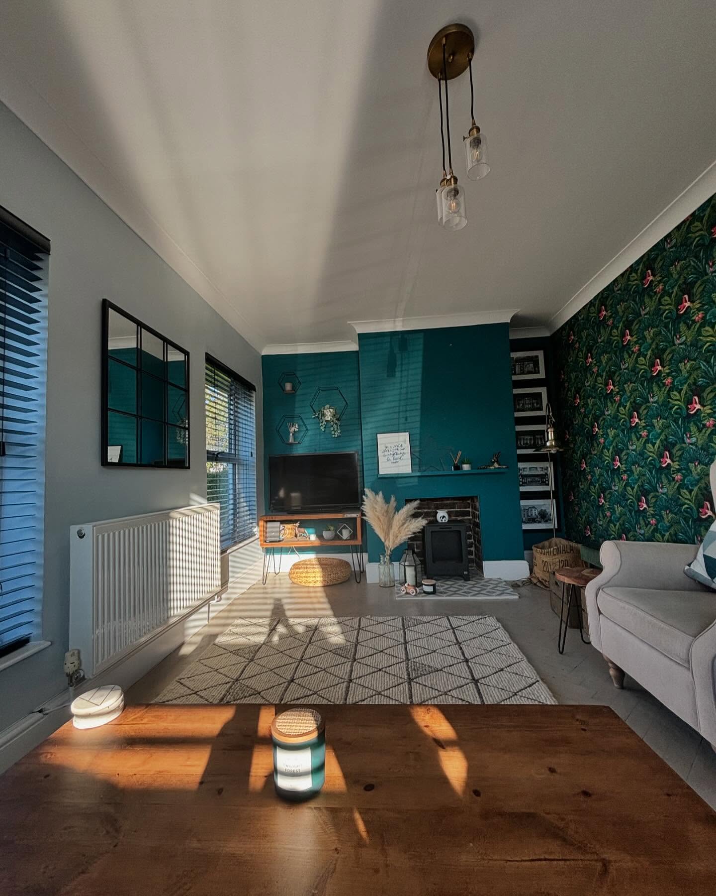 20. Connect a Teal Fireplace Wall to Botanical Wallpaper