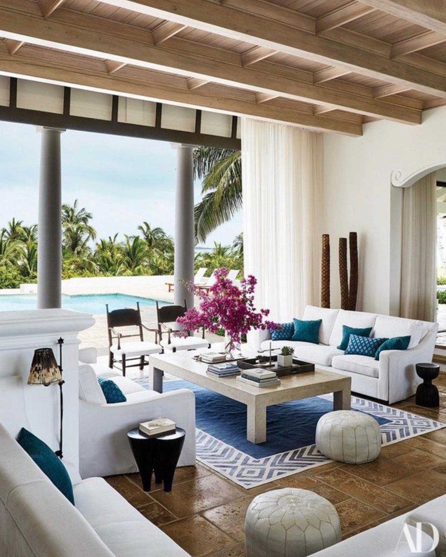 4. Soften a Coastal Seating Group With Stitched Poufs