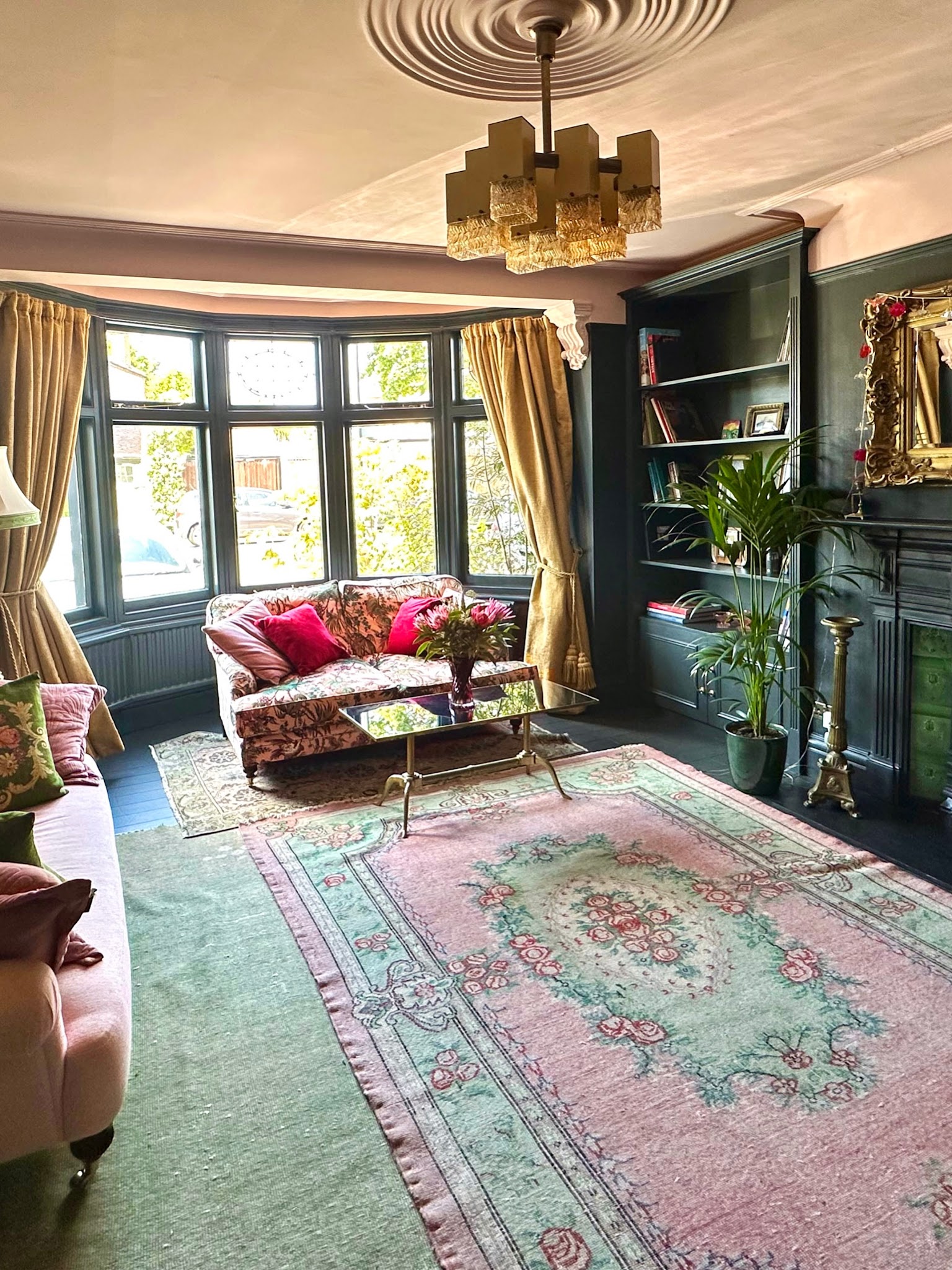 3. Layer Vintage Rugs Beneath a Statement Chandelier