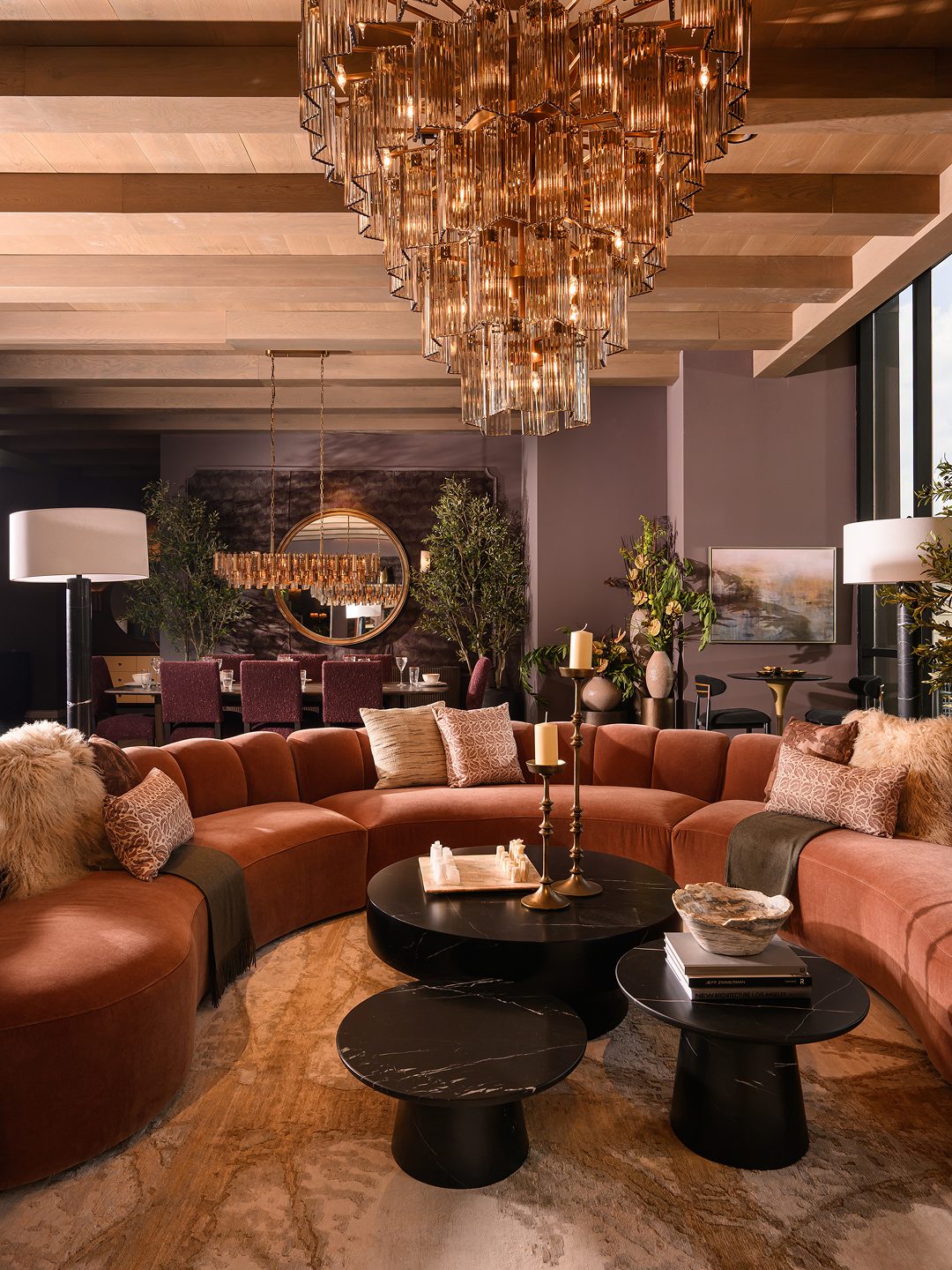10. Balance a Curved Rust Sofa With a Cascading Chandelier