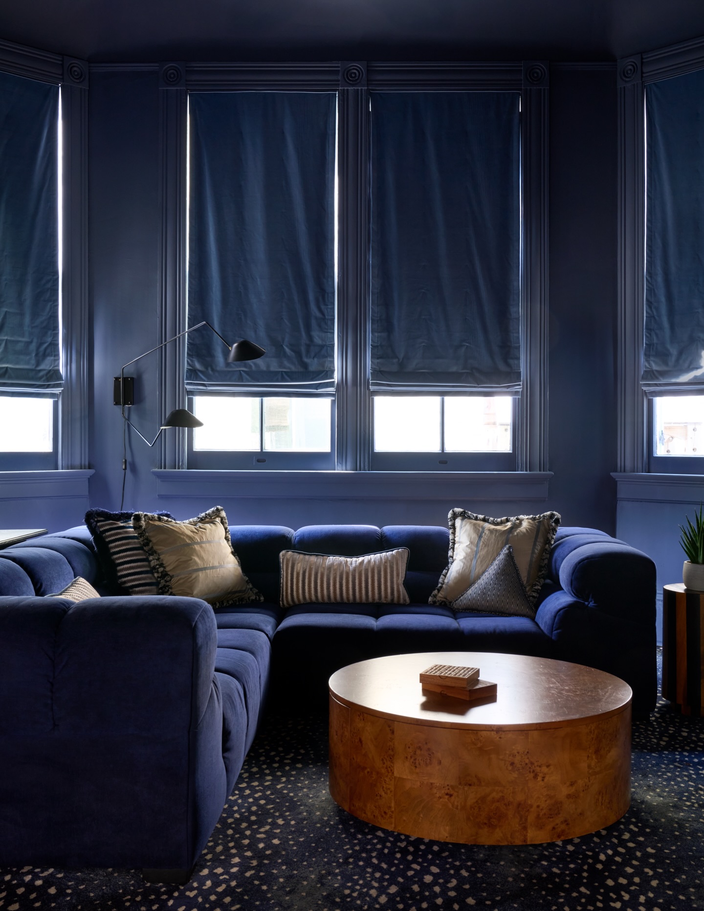 2. Set a Burl Table Inside a Deep Blue Den