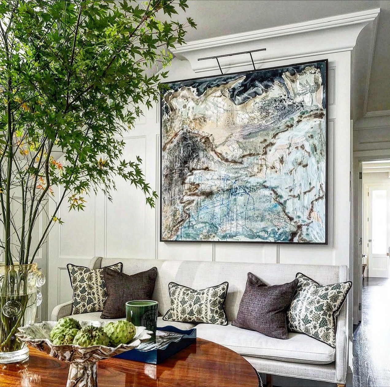 9. Use Blue Artwork Above a Polished Brown Table
