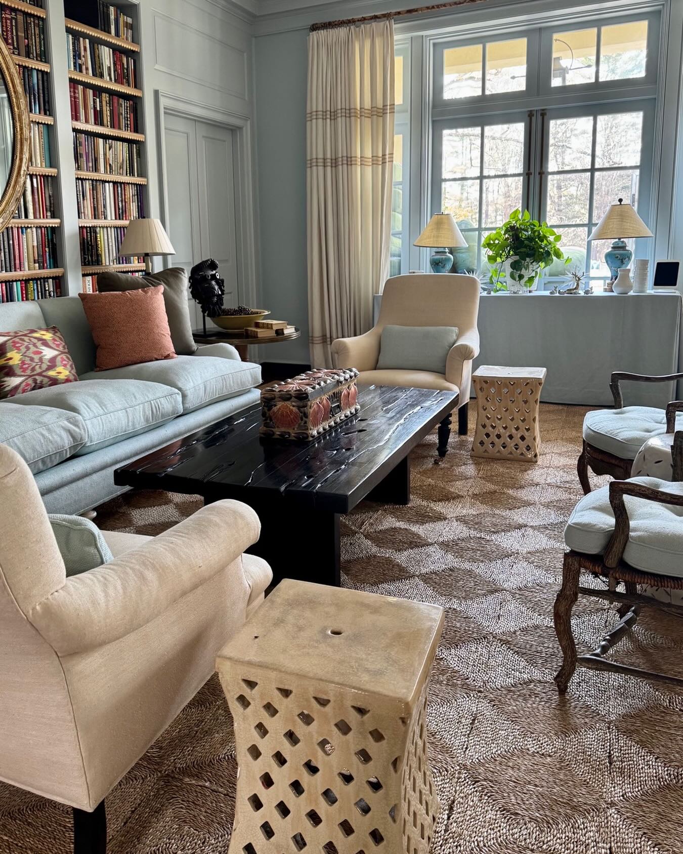 15. Anchor Powder Blue Seating With a Brown Woven Rug