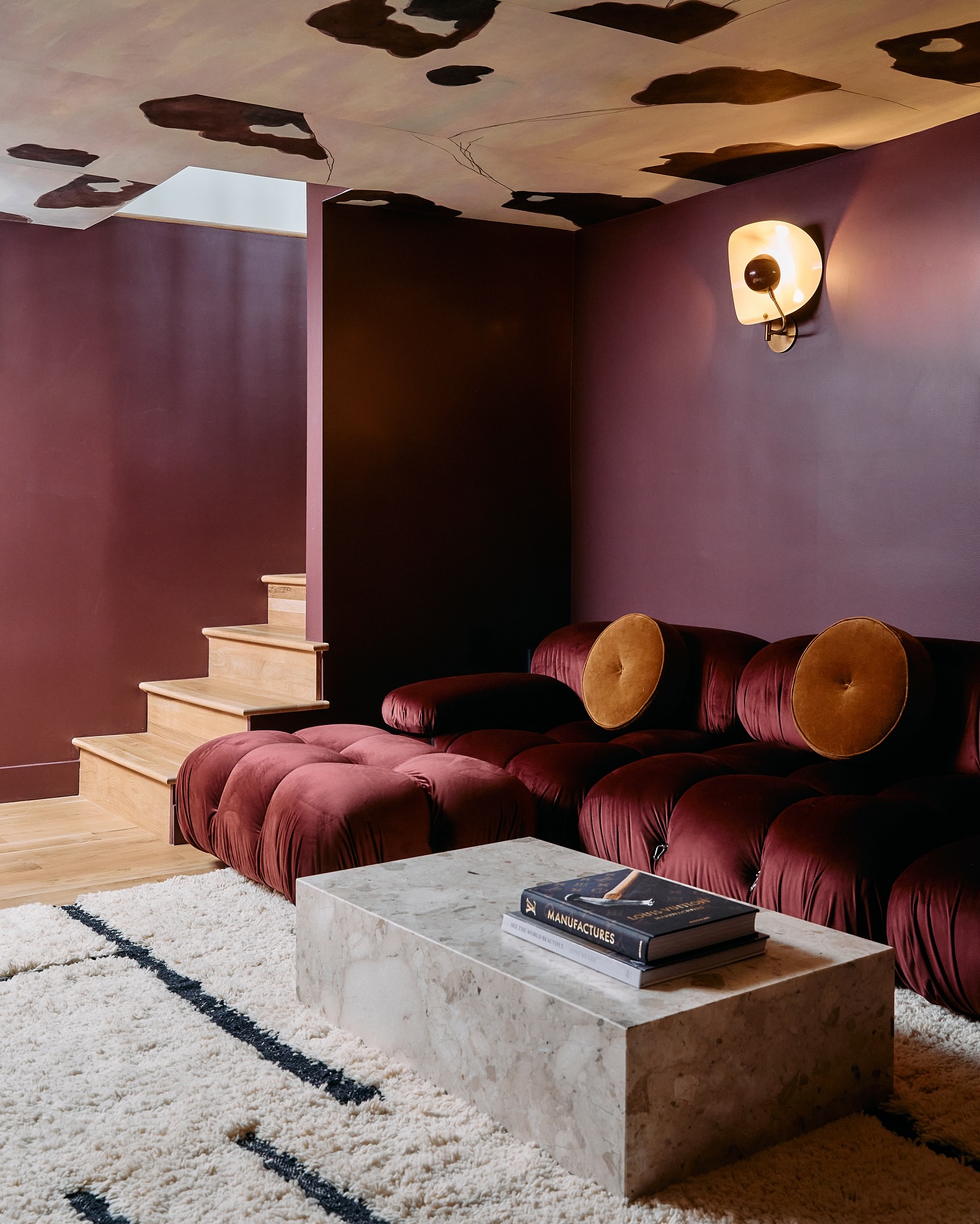 2. Give a Burgundy Den a Playful Ceiling
