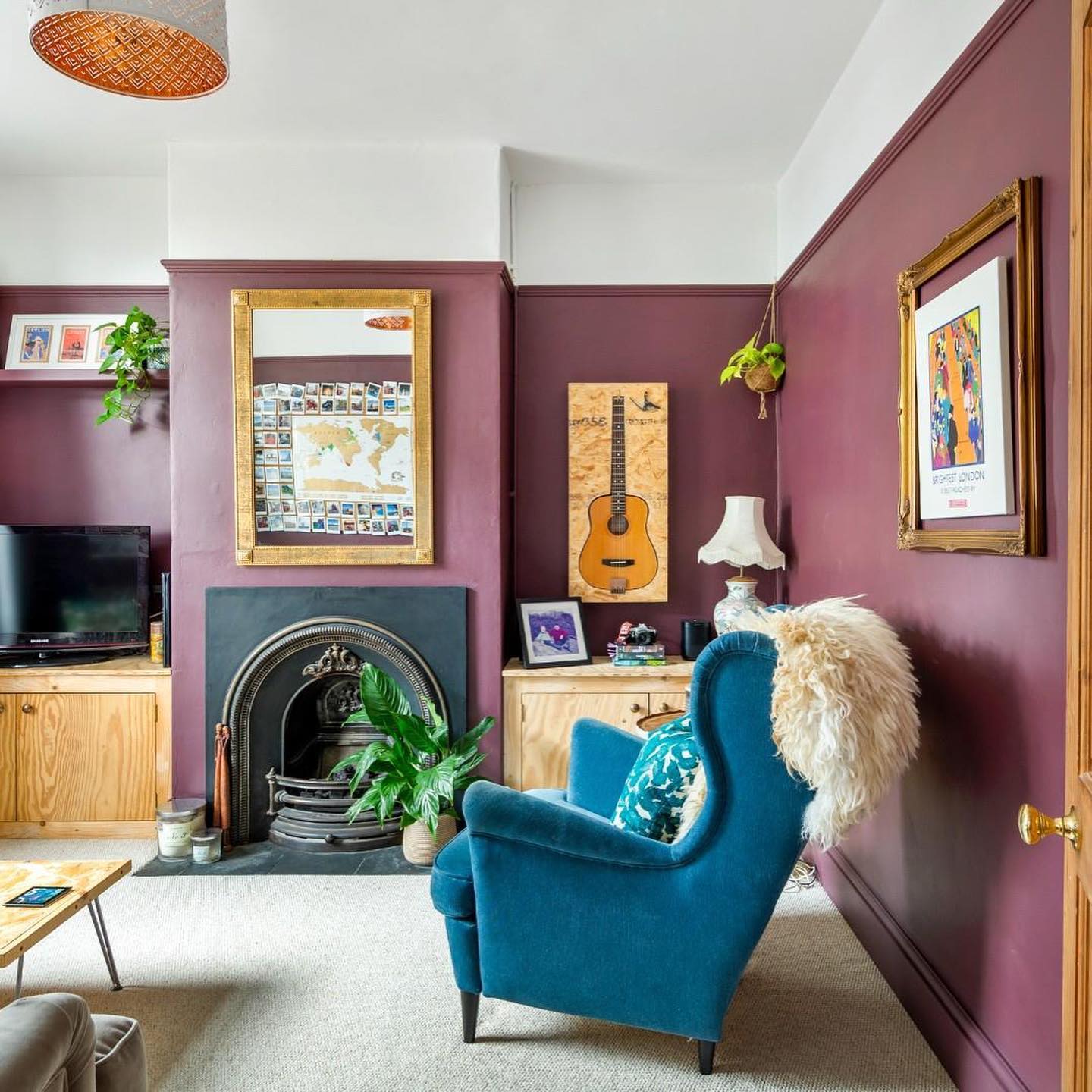 3. Pair Burgundy Walls with a Teal Armchair